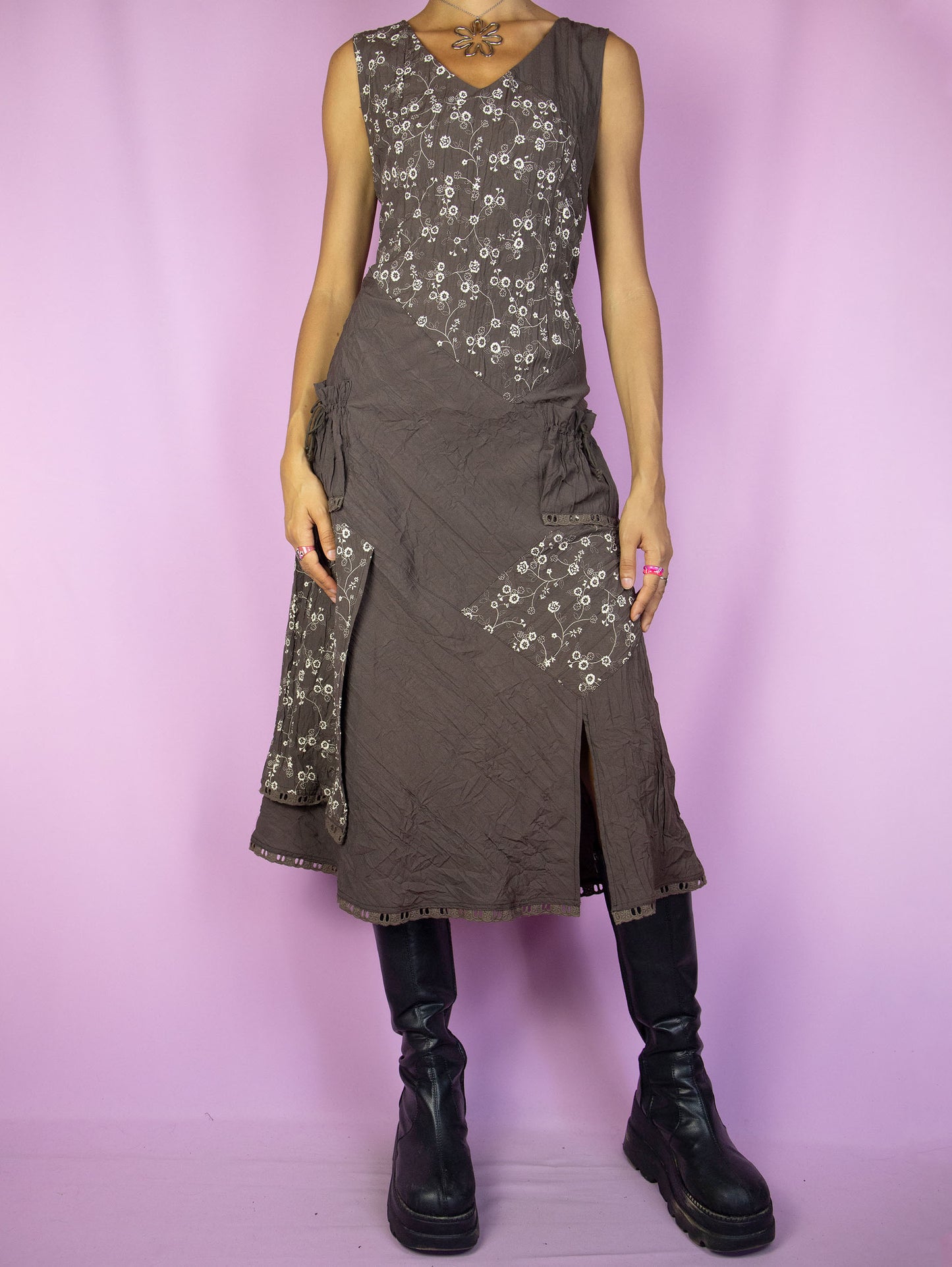 The Vintage 90s Fairy Brown Midi Dress is a sleeveless brown and beige dress with floral details, pockets, a v-neck, and a back zipper closure. Boho grunge 1990s summer maxi dress.
