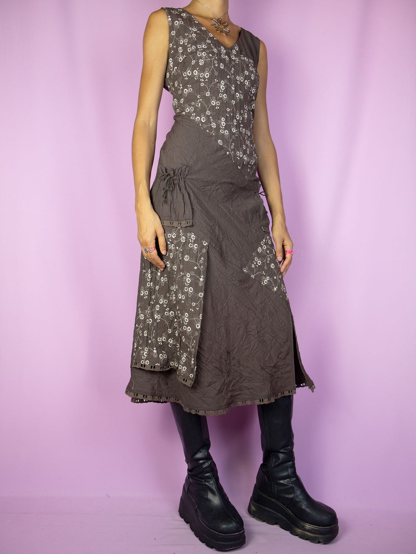 The Vintage 90s Fairy Brown Midi Dress is a sleeveless brown and beige dress with floral details, pockets, a v-neck, and a back zipper closure. Boho grunge 1990s summer maxi dress.