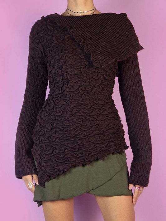 The Y2K Brown Asymmetric Knit Sweater is a vintage 2000s dark brown pullover with a distinct asymmetric design, a textured, crinkle-knit pattern across the body, complemented by a ribbed knit panel that drapes elegantly over one shoulder. Perfect for adding an avant-garde touch to your autumn or winter wardrobe.
