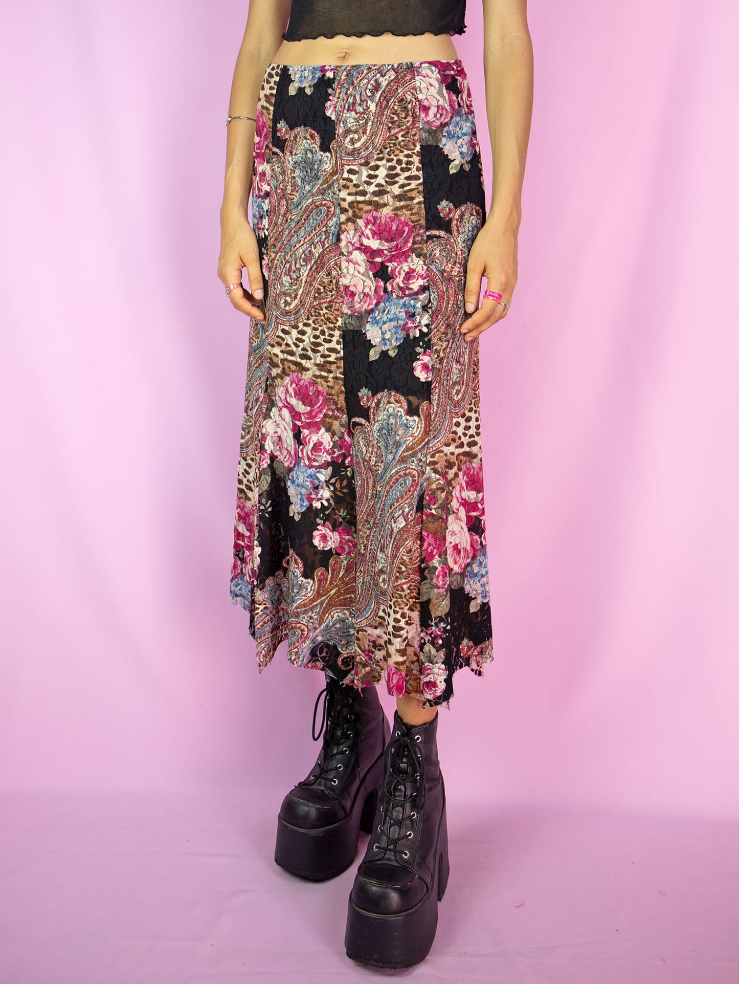 The Y2K Boho Lace Midi Skirt is a vintage floral abstract paisley animal print pattern mesh skirt with a spliced hem and an elasticated waist. Avant garde fairy grunge 2000s summer maxi skirt.