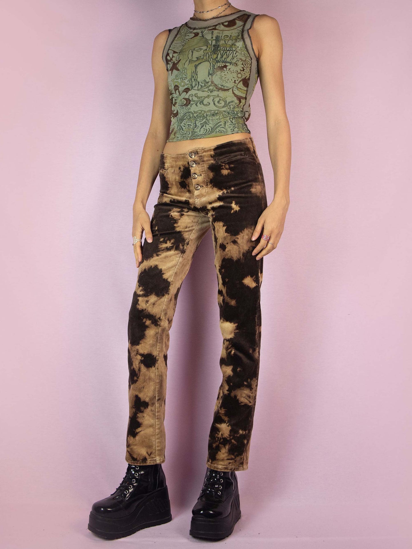 The Vintage 90s Brown Tie Dye Pants are low-rise straight-leg bleached-effect corduroy elastic festival grunge-style pants with button closure.