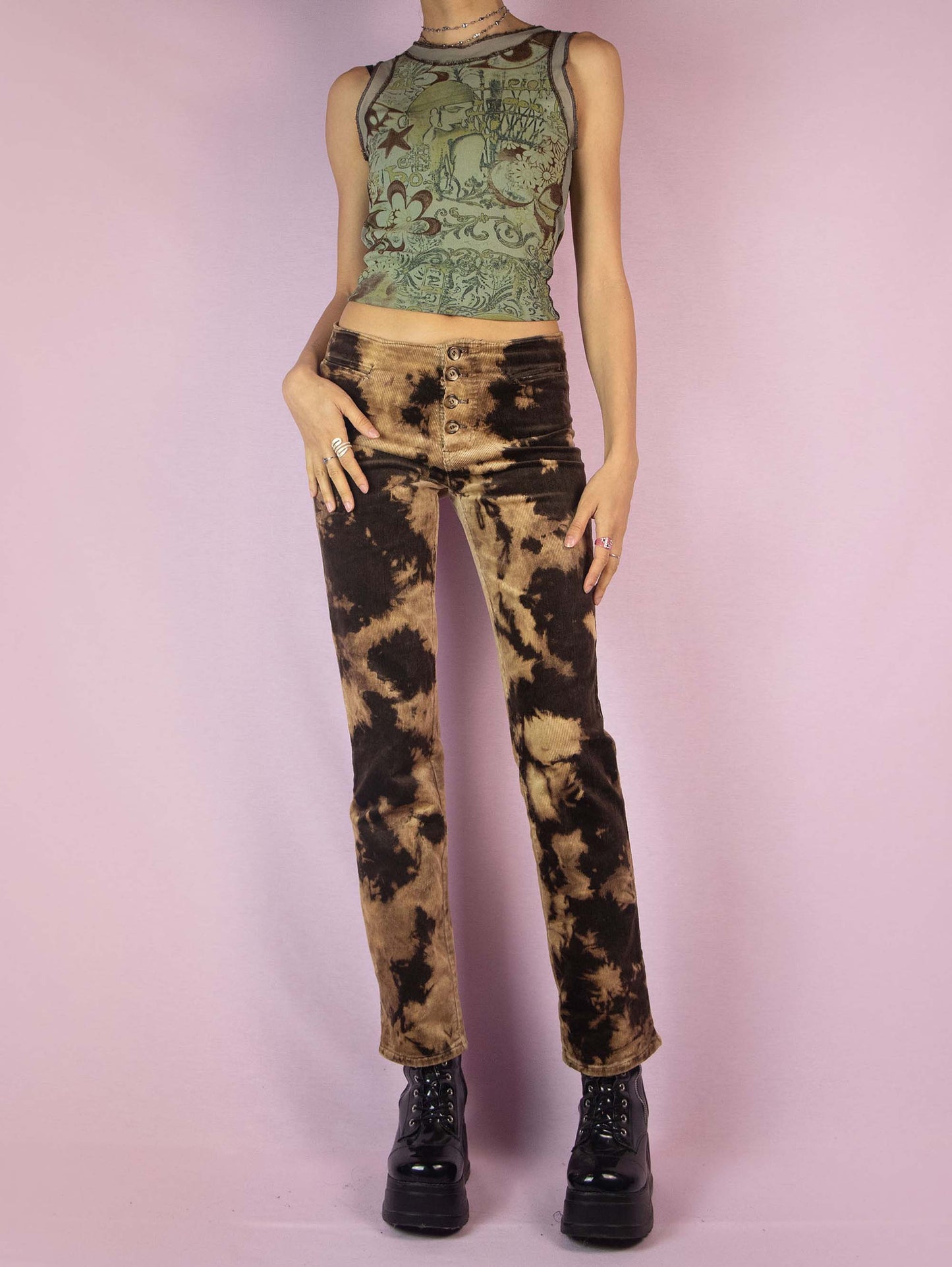 The Vintage 90s Brown Tie Dye Pants are low-rise straight-leg bleached-effect corduroy elastic festival grunge-style pants with button closure.