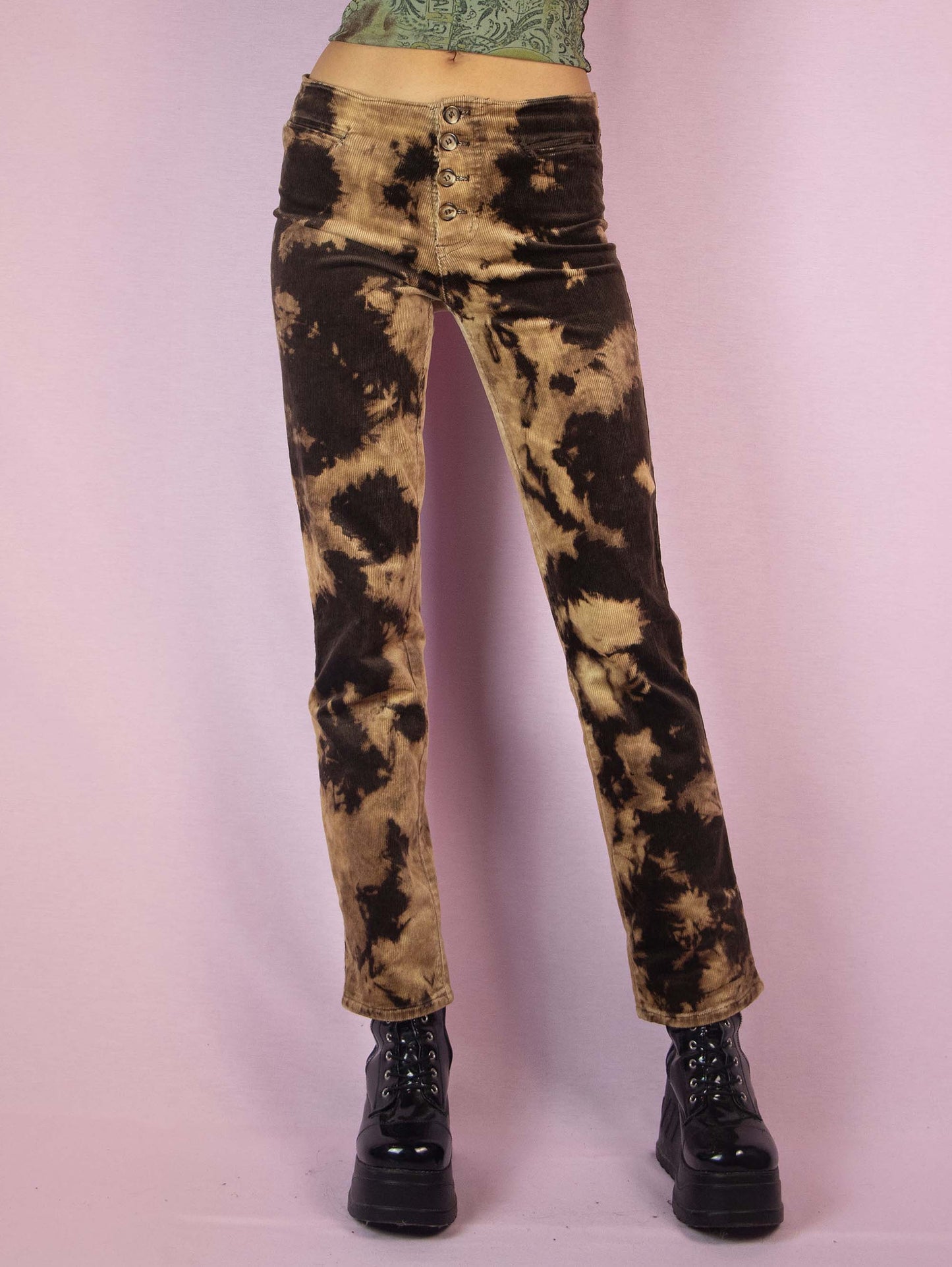 The Vintage 90s Brown Tie Dye Pants are low-rise straight-leg bleached-effect corduroy elastic festival grunge-style pants with button closure.