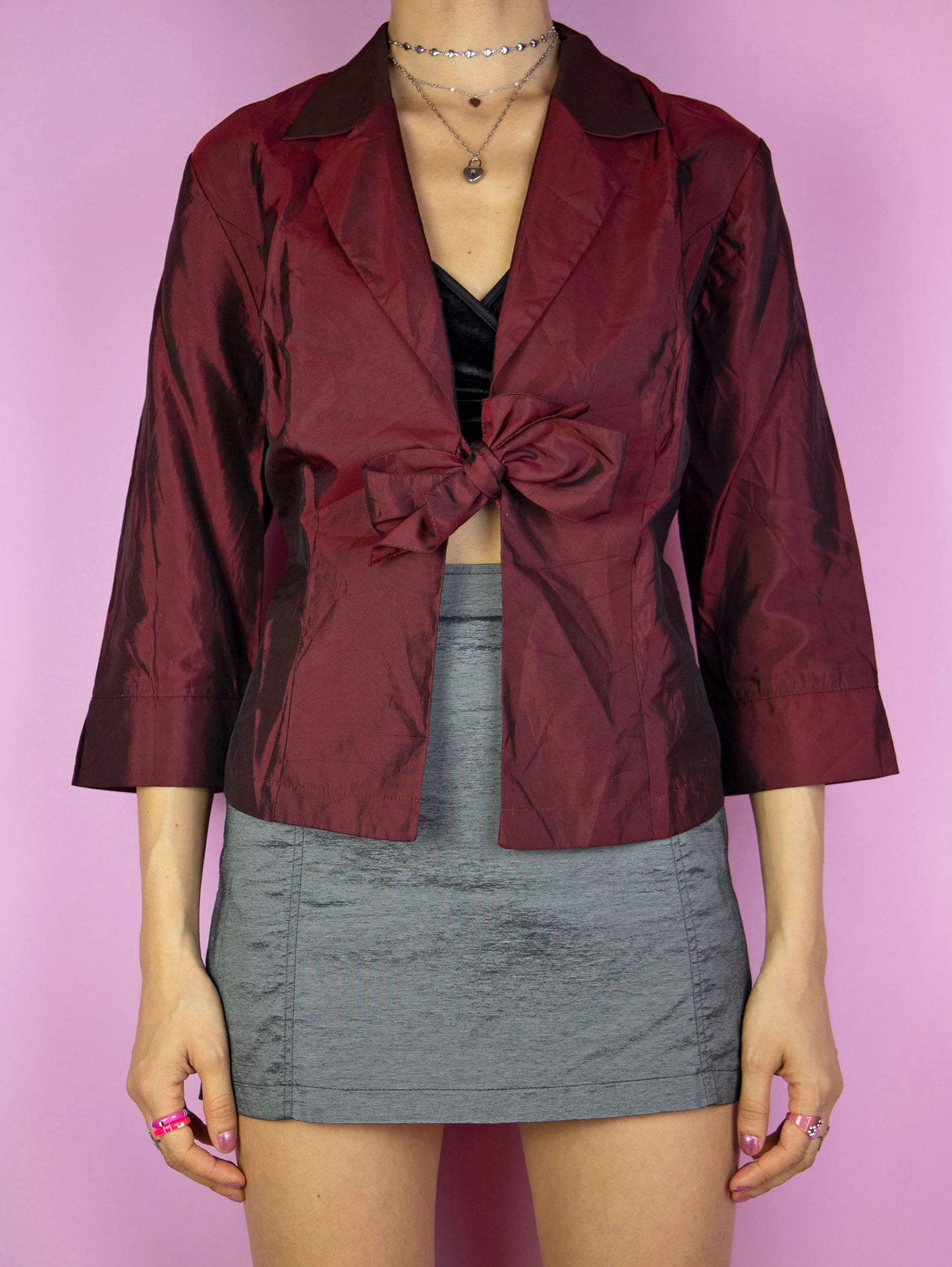 The Y2K Maroon Tie Bolero Jacket is a vintage 2000s elegant party style iridescent shimmering burgundy red half-sleeve top that ties in the front.