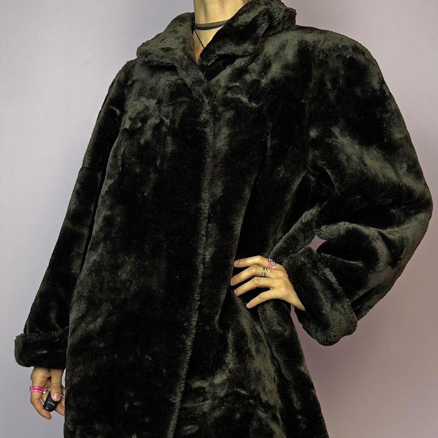 The Vintage 90s Brown Faux Fur Maxi Coat is a luxurious and warm winter essential. This long coat features a plush faux fur design in a deep brown hue, a wide collar and a pullover front closure. Its full length make it perfect for cozy