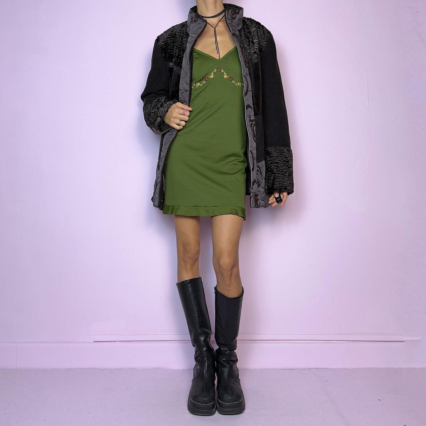 The Y2K Brown Contrast Panel Jacket is a vintage 2000s piece featuring a striking mixed-material design in dark brown with textured panels, including quilted, faux fur, and velvety fabric sections. It comes with a zipper and snap button closure
