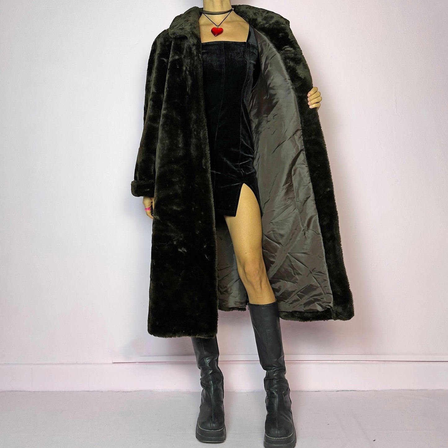 The Vintage 90s Brown Faux Fur Maxi Coat is a luxurious and warm winter essential. This long coat features a plush faux fur design in a deep brown hue, a wide collar and a pullover front closure. Its full length make it perfect for cozy