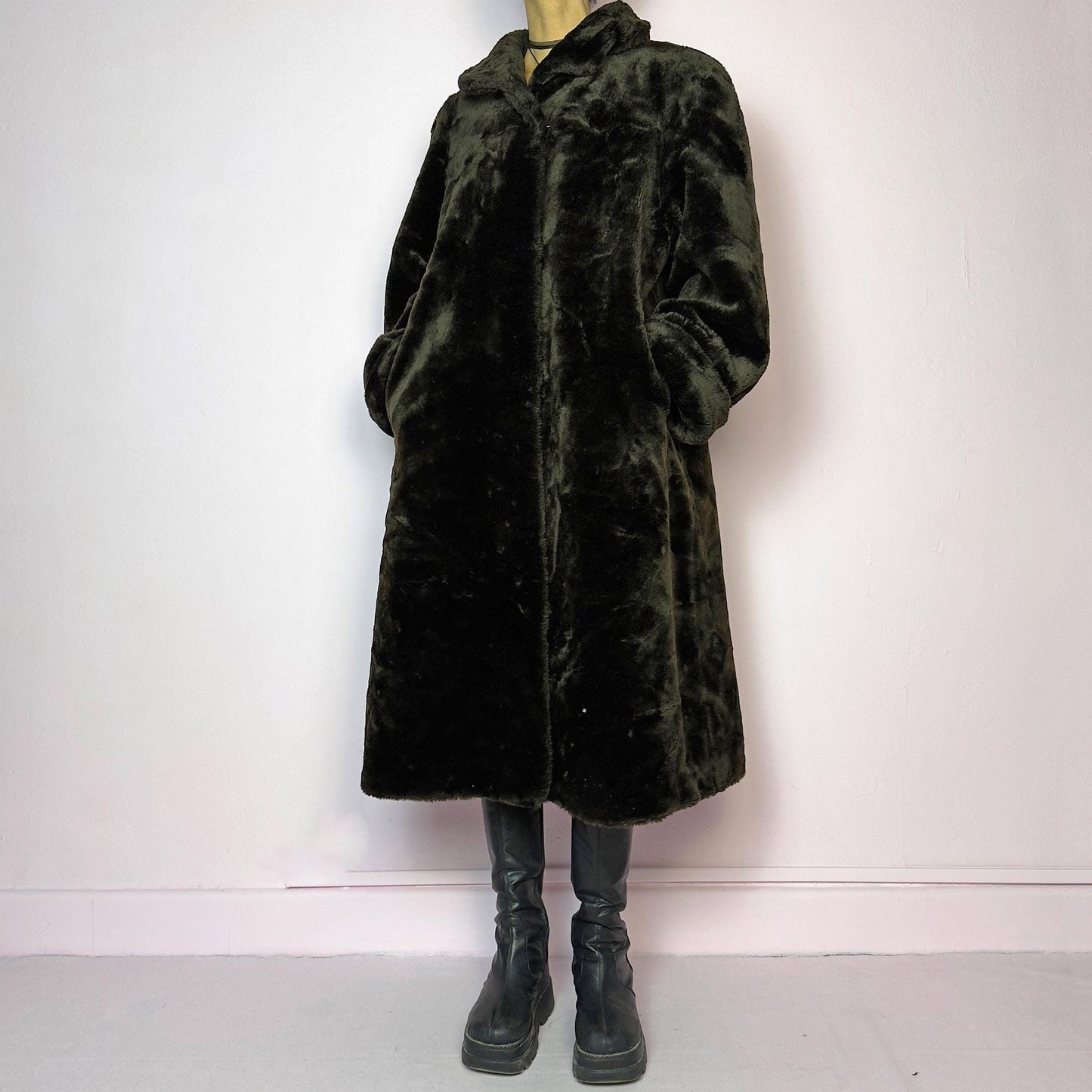 The Vintage 90s Brown Faux Fur Maxi Coat is a luxurious and warm winter essential. This long coat features a plush faux fur design in a deep brown hue, a wide collar and a pullover front closure. Its full length make it perfect for cozy
