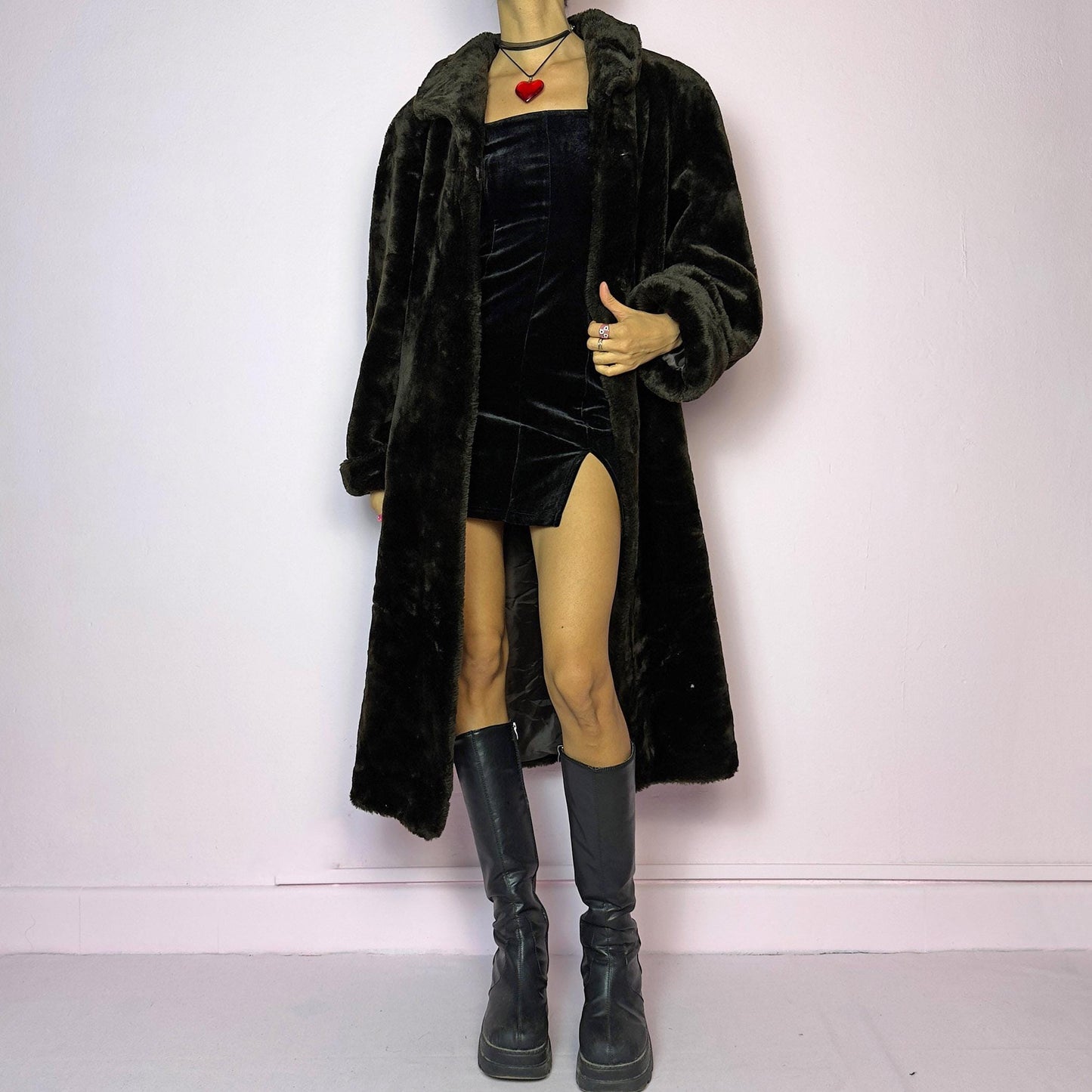 The Vintage 90s Brown Faux Fur Maxi Coat is a luxurious and warm winter essential. This long coat features a plush faux fur design in a deep brown hue, a wide collar and a pullover front closure. Its full length make it perfect for cozy