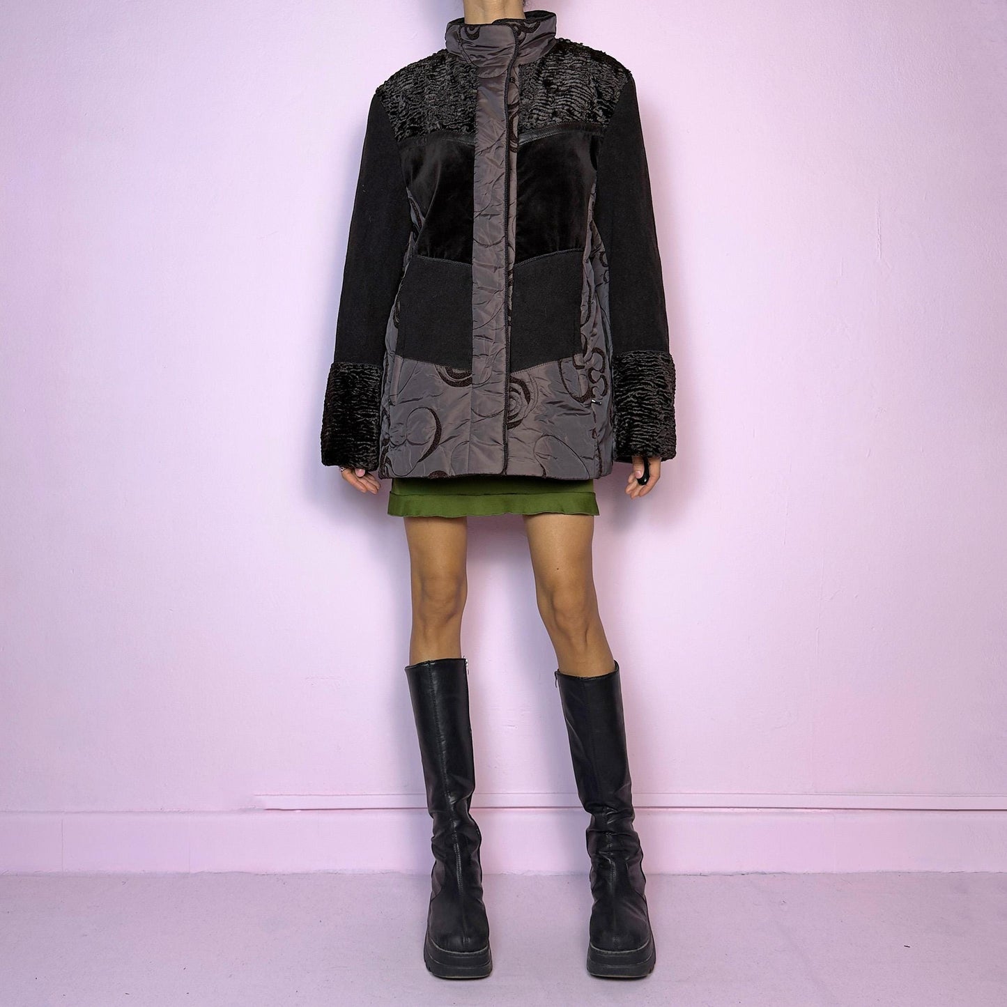 The Y2K Brown Contrast Panel Jacket is a vintage 2000s piece featuring a striking mixed-material design in dark brown with textured panels, including quilted, faux fur, and velvety fabric sections. It comes with a zipper and snap button closure