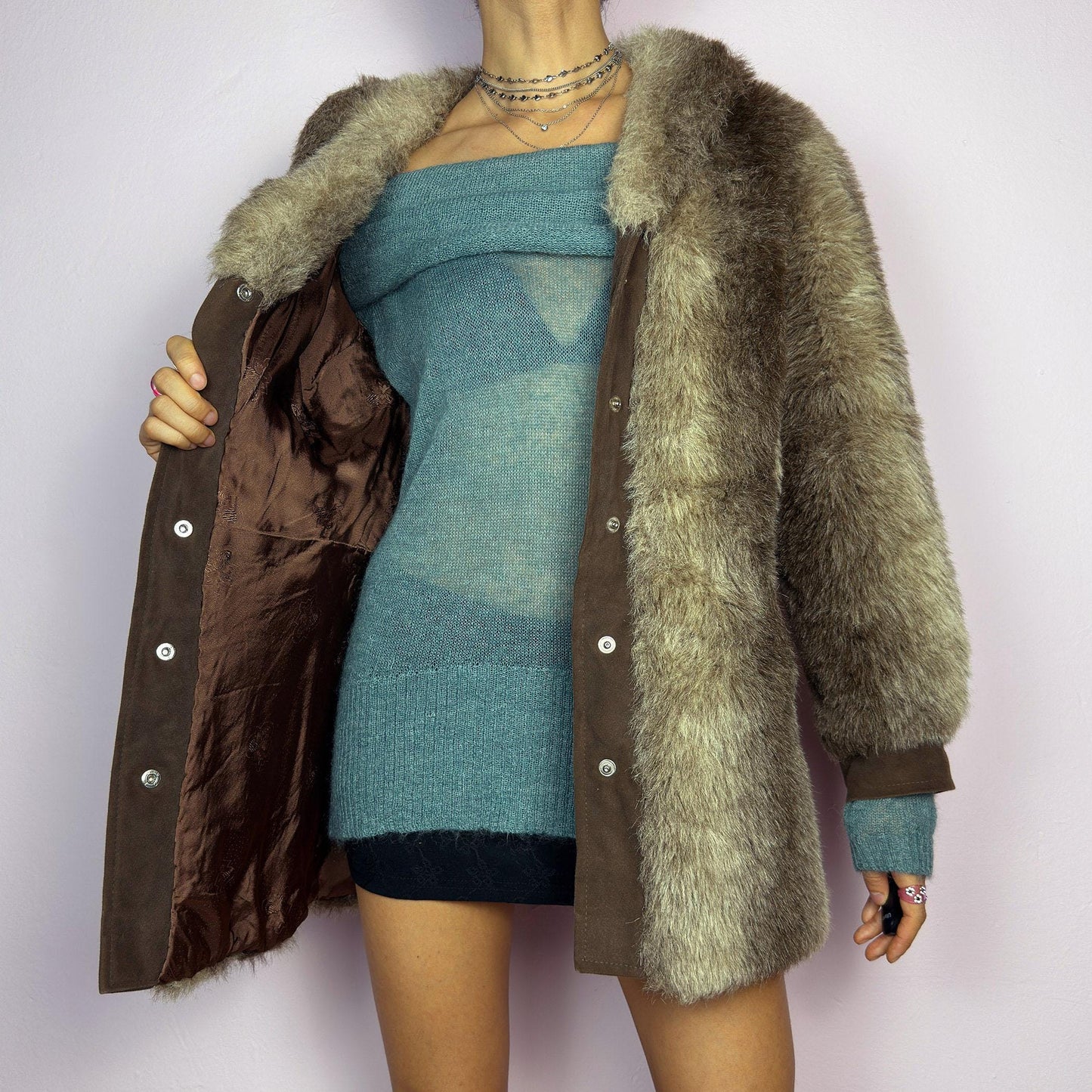 The Vintage 90s Plush Faux Fur Coat is a statement outerwear piece exuding warmth and glamour. This coat features a plush faux fur texture in earthy tones, creating a cozy look. Designed with a snap button-front closure. adult world shop
