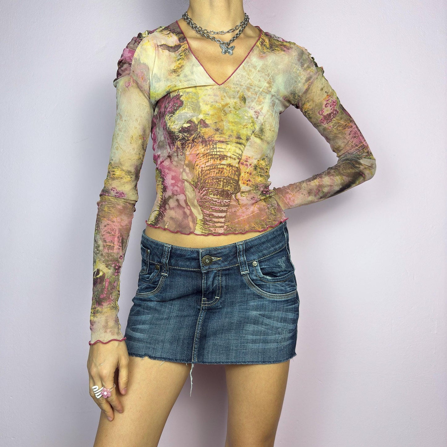 The Y2K Low Rise Mini Dark Denim Skirt s a 2000s essential, featuring a short micro length with a low-rise waist, a zipper and button closure, and crafted from a dark-wash stretch denim. Designed with raw hem, and a five-pocket. adult world shop