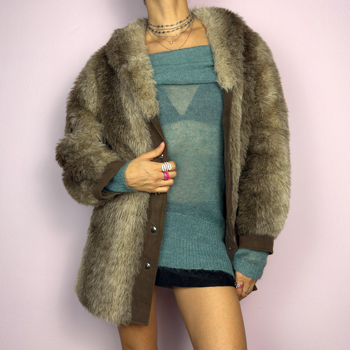 The Vintage 90s Plush Faux Fur Coat is a statement outerwear piece exuding warmth and glamour. This coat features a plush faux fur texture in earthy tones, creating a cozy look. Designed with a snap button-front closure. adult world shop