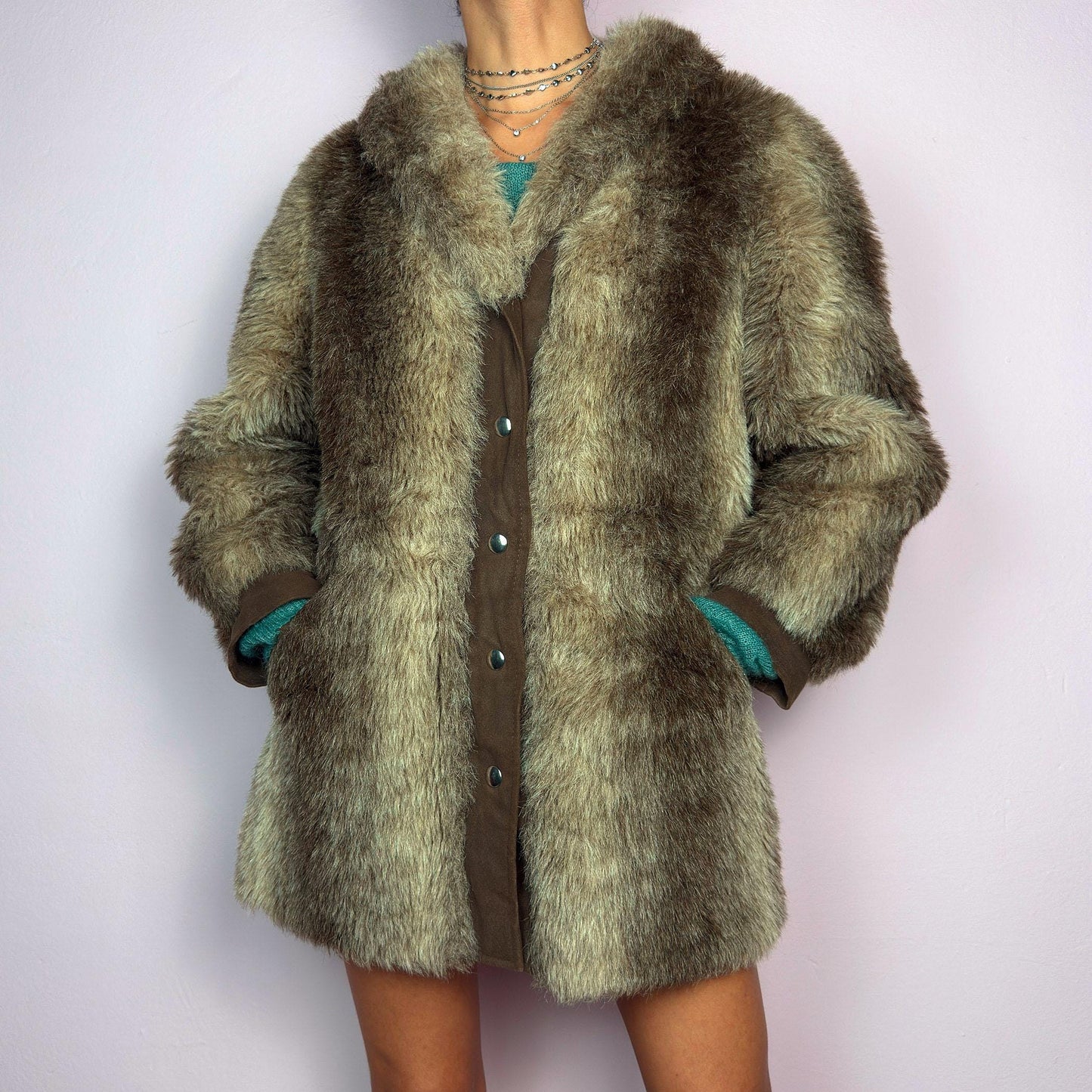 The Vintage 90s Plush Faux Fur Coat is a statement outerwear piece exuding warmth and glamour. This coat features a plush faux fur texture in earthy tones, creating a cozy look. Designed with a snap button-front closure. adult world shop