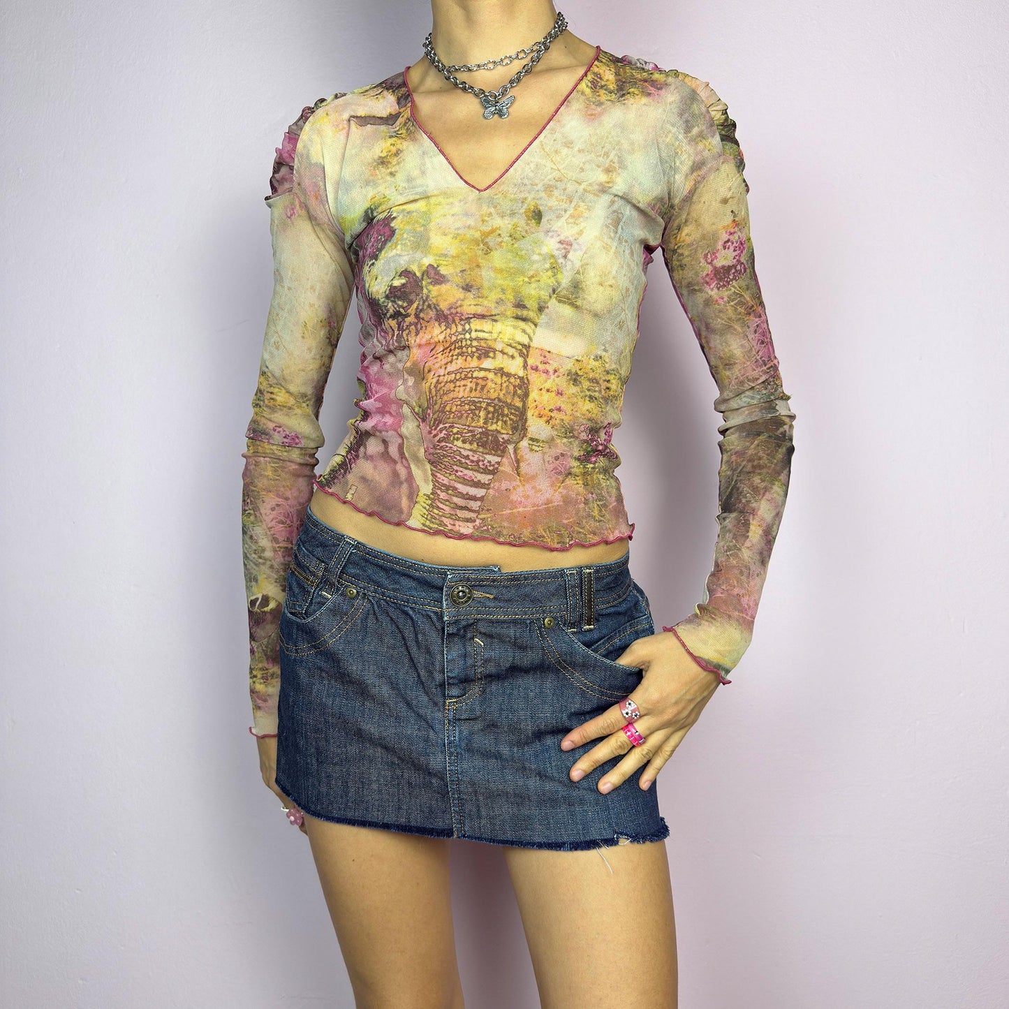 The Y2K Dark Denim Low-Rise Micro Mini Skirt is a vintage 2000s staple, featuring a short micro fit with a low-rise waist and a raw hem for an effortlessly edgy look. Crafted from dark-wash denim with contrast stitching. adult world shop