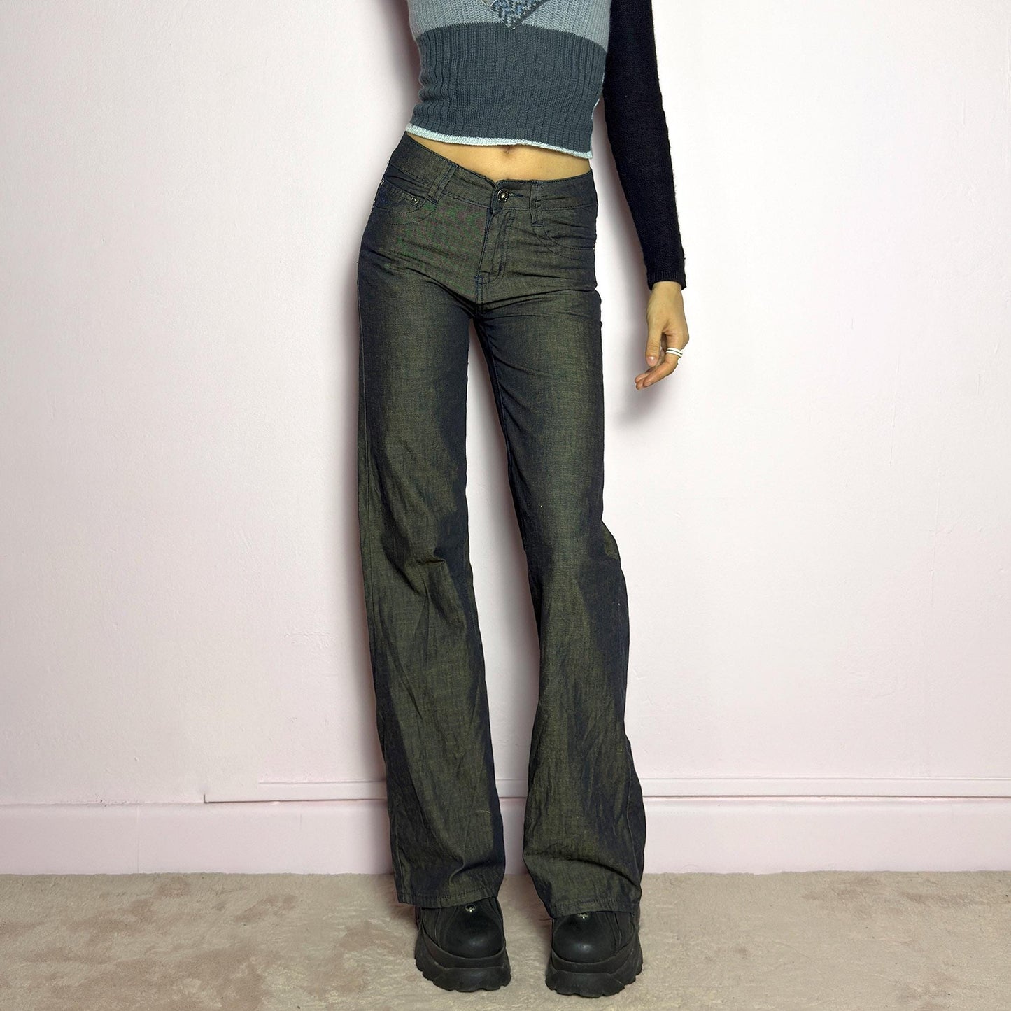 The Y2K Dark Rust Wide Jeans are a vintage 2000s statement piece featuring a structured denim fabric with a unique rust-effect wash, adding a worn-in, vintage appeal. Designed with a high-rise fit, button and zipper closure, and pockets, these jeans have a relaxed wide-leg silhouette that creates an effortlessly cool look. Perfect for edgy streetwear and casual outfits. adult world shop