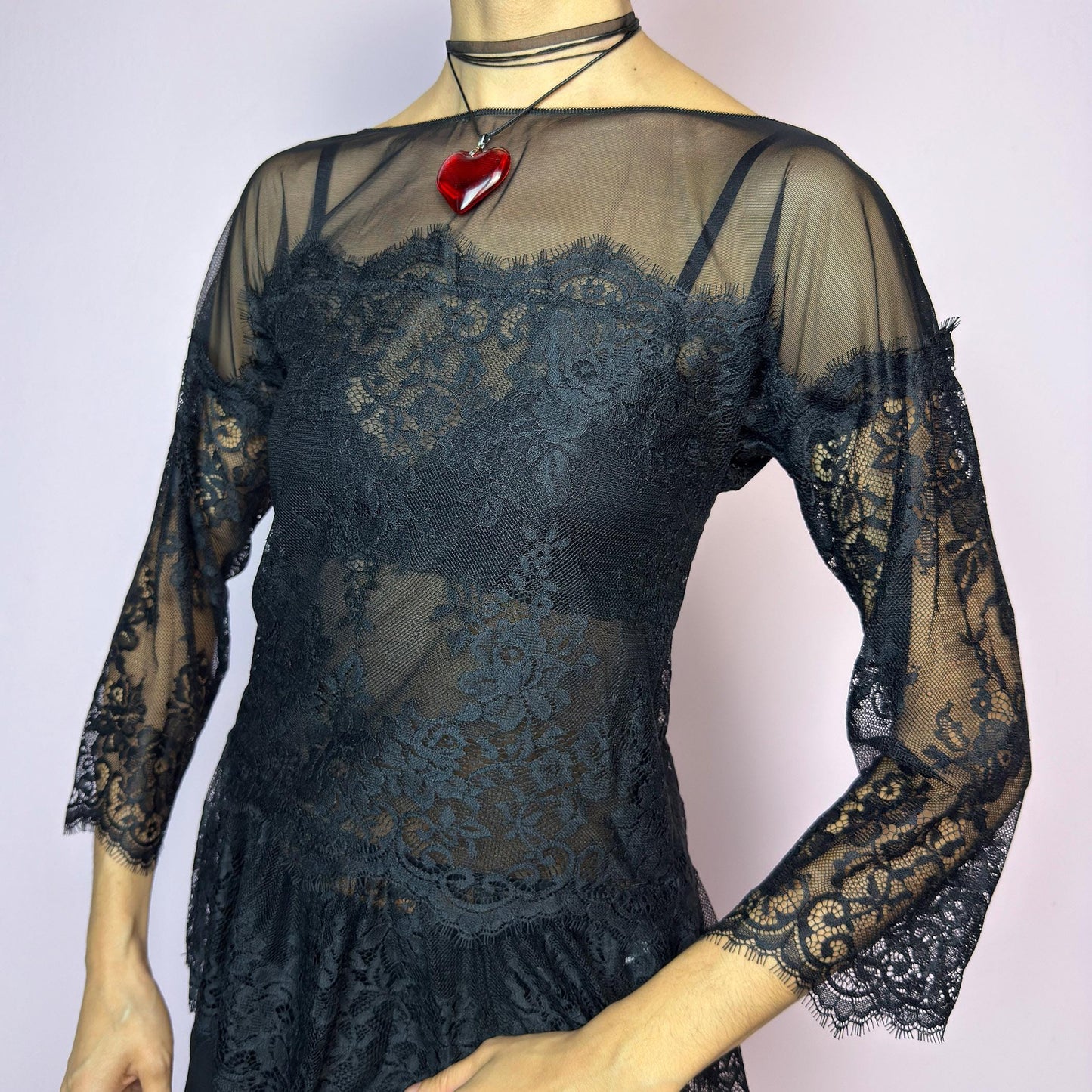 The Y2K Black Lace Peplum Top is a vintage 2000s piece featuring sheer mesh panels, floral lace detailing, and a flattering peplum hem. Designed with three-quarter length sleeves and a boat neckline for an elegant yet sultry silhouette. Perfect for layering or styling for a night out. Stretchy and lightweight for a comfortable fit. Excellent vintage condition. adult world shop