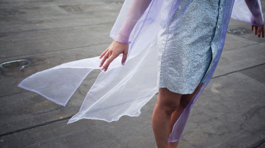 person wearing a vintage shirt blowing in the wind, representing vintage fashion