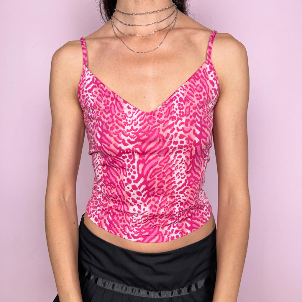 Vintage 2000s Blugirl by Blumarine pink leopard print cami top. A bold Y2K designer piece with thin straps, a flattering V-neckline, and a fitted feminine silhouette. The vibrant hot pink animal print gives it playful Italian glam energy. Stretchy with a swimwear-like feel, ideal for summer beach styling. Made in Italy from a polyamide and elastane blend. Excellent vintage condition.