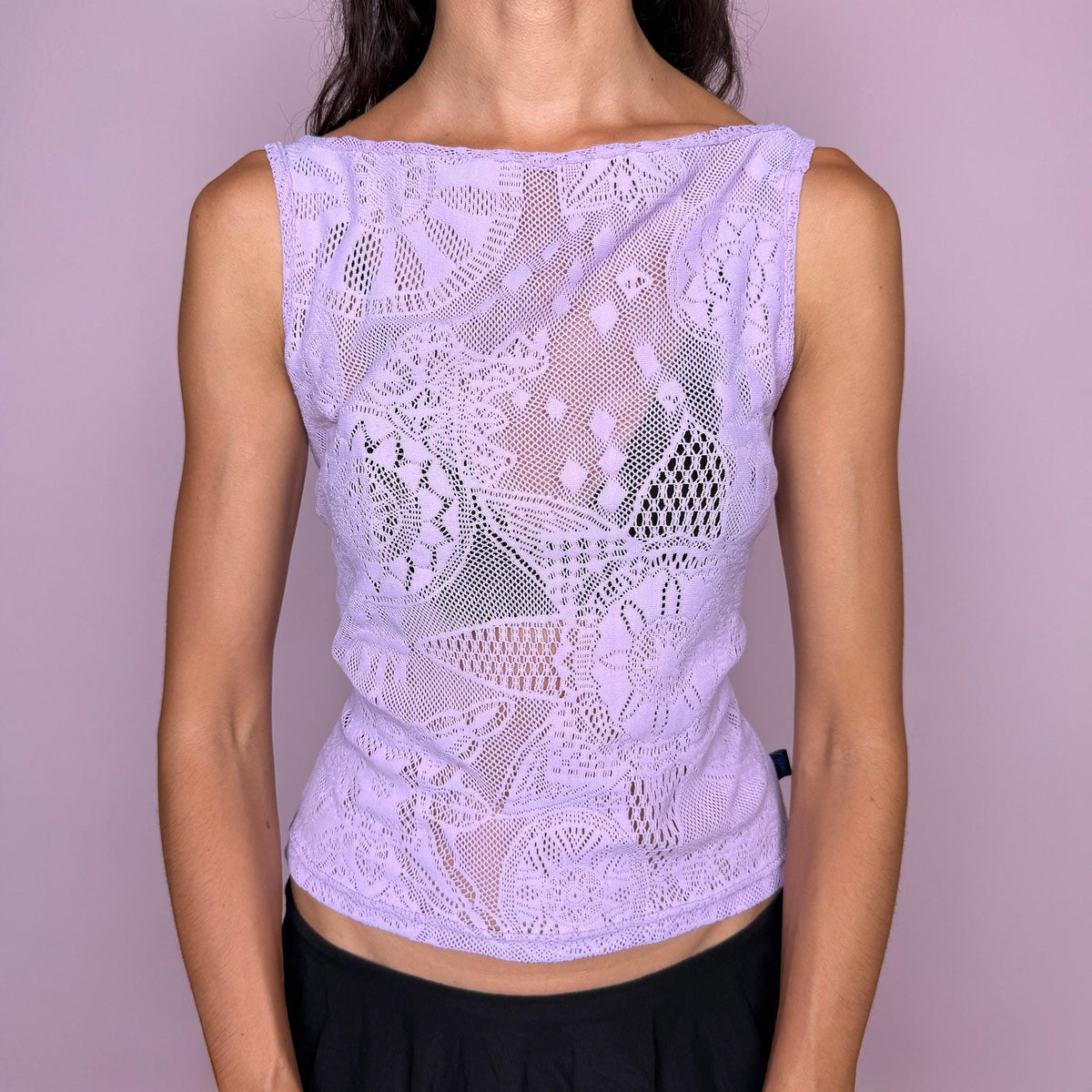 Vintage 2000s pastel lilac lace top by Christian Lacroix Jeans, made in Italy from a stretchy 95% polyamide and 5% elastane blend. Features an intricate semi-sheer floral lace construction, a sleeveless fitted silhouette, and a soft boat neckline. The dreamy pastel lilac tone and ornate lace pattern give it a romantic, ethereal Y2K designer feel. Excellent vintage condition.