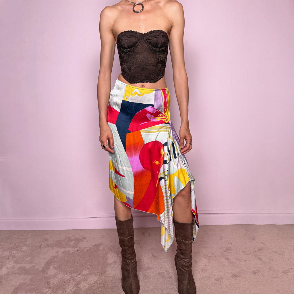 Vintage 2000s Christian Lacroix Bazar asymmetric skirt made in France from 100% silk. Features a bold multicolor abstract print, side zip closure, no stretch, and a beautiful asymmetric draped hem. A rare designer statement piece with an artistic Y2K resort feel, perfect for elevated summer looks. Can be worn high-waisted for size S or lower-rise for XS.