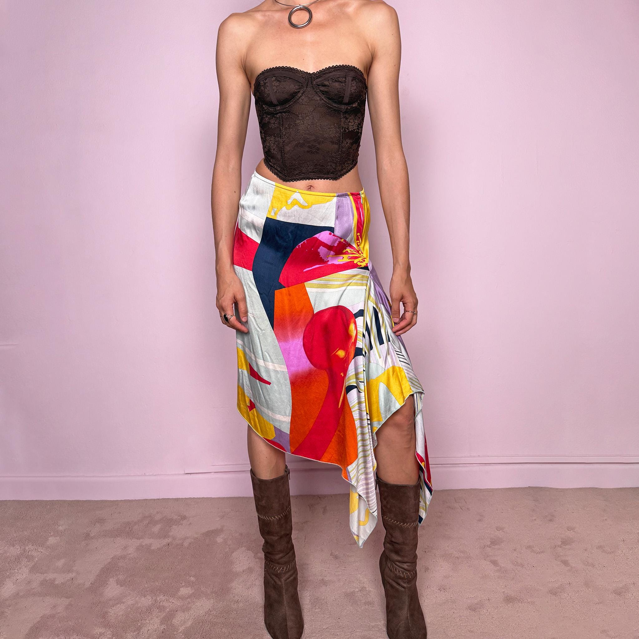 Vintage 2000s Christian Lacroix Bazar asymmetric skirt made in France from 100% silk. Features a bold multicolor abstract print, side zip closure, no stretch, and a beautiful asymmetric draped hem. A rare designer statement piece with an artistic Y2K resort feel, perfect for elevated summer looks. Can be worn high-waisted for size S or lower-rise for XS.