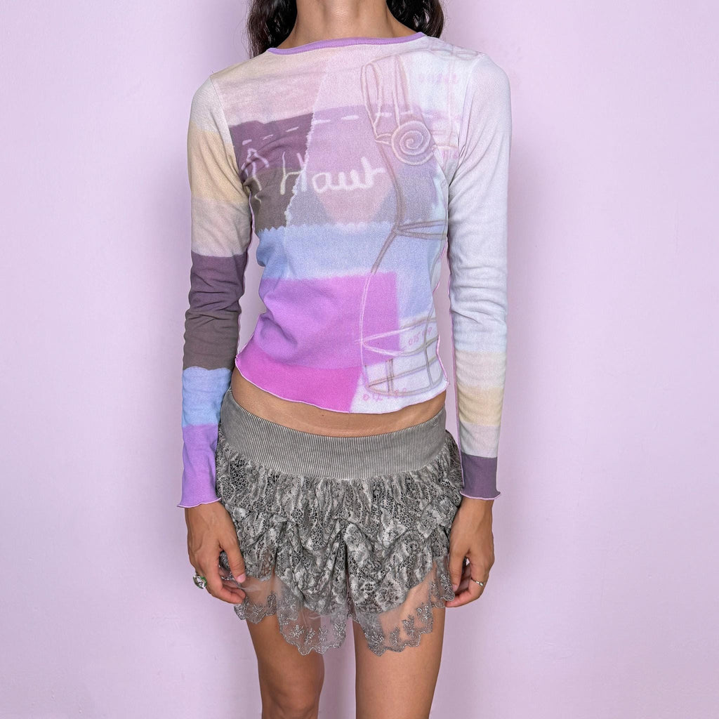 Vintage 2000s Cop Copine long-sleeve top featuring a soft pastel graphic print in lilac, cream, and pink tones. Designed with a fitted silhouette, round neckline, and contrasting color-blocked sleeves. Soft and stretchy with a lightweight, second-skin feel. A playful pastel Y2K piece by a French brand with a dreamy graphic-art aesthetic. The composition label is missing, so the exact fabric is unknown. Excellent vintage condition.