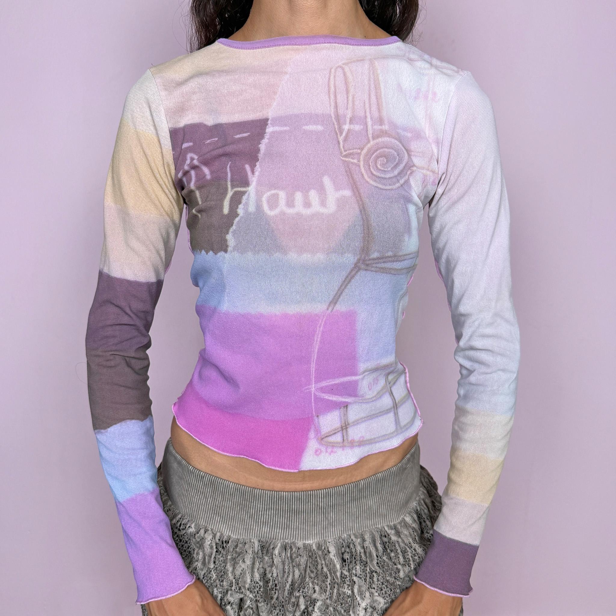 Vintage 2000s Cop Copine long-sleeve top featuring a soft pastel graphic print in lilac, cream, and pink tones. Designed with a fitted silhouette, round neckline, and contrasting color-blocked sleeves. Soft and stretchy with a lightweight, second-skin feel. A playful pastel Y2K piece by a French brand with a dreamy graphic-art aesthetic. The composition label is missing, so the exact fabric is unknown. Excellent vintage condition.