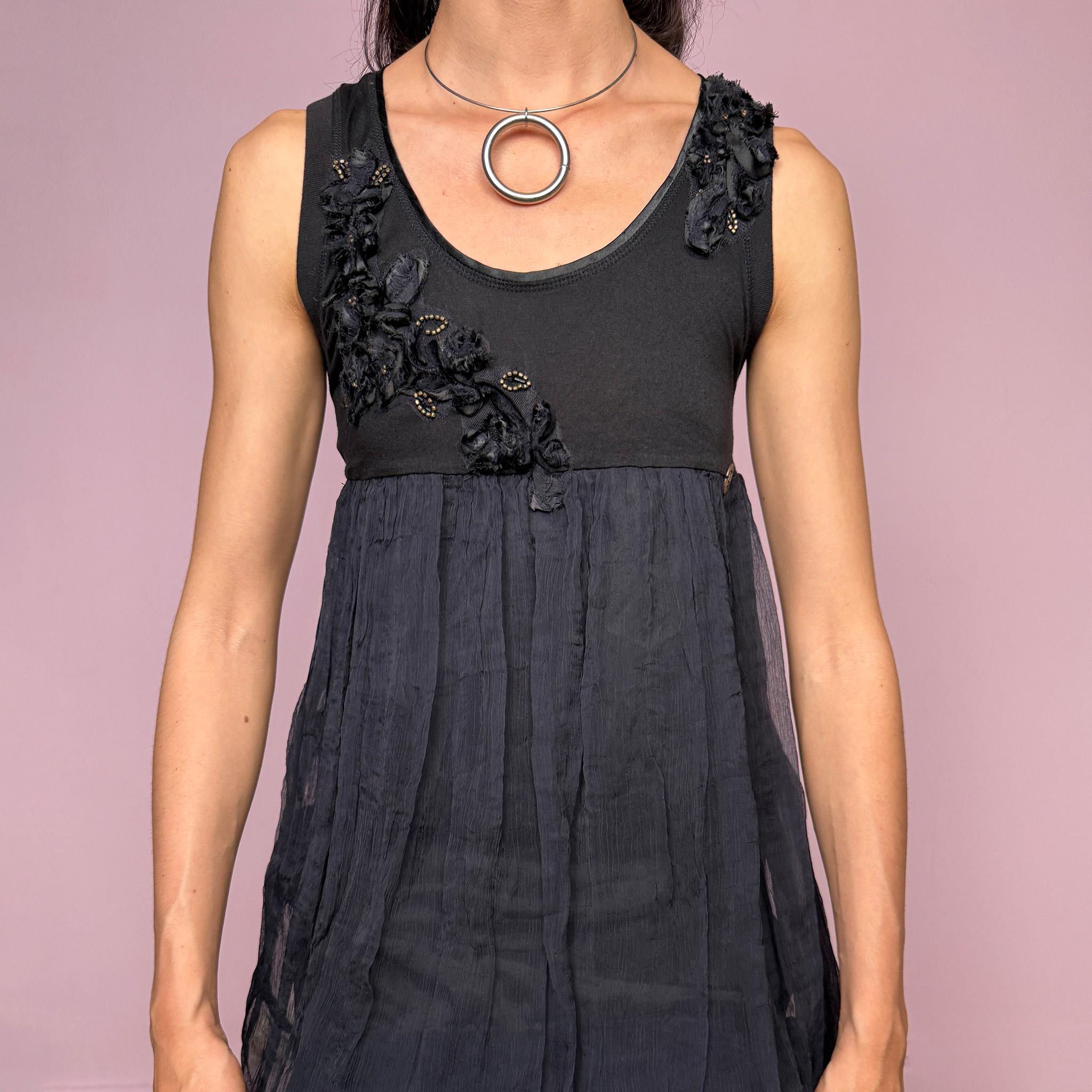 Vintage 2000s Galliano black bubble mini dress featuring a fitted stretchy cotton sleeveless bodice, floral appliqué details at the neckline, a voluminous crinkled semi-sheer viscose overlay, and a bubble hem silhouette. Beautiful late 90s / early 2000s dark romantic, slightly gothic, and very feminine aesthetic, perfect for elevated evening looks.