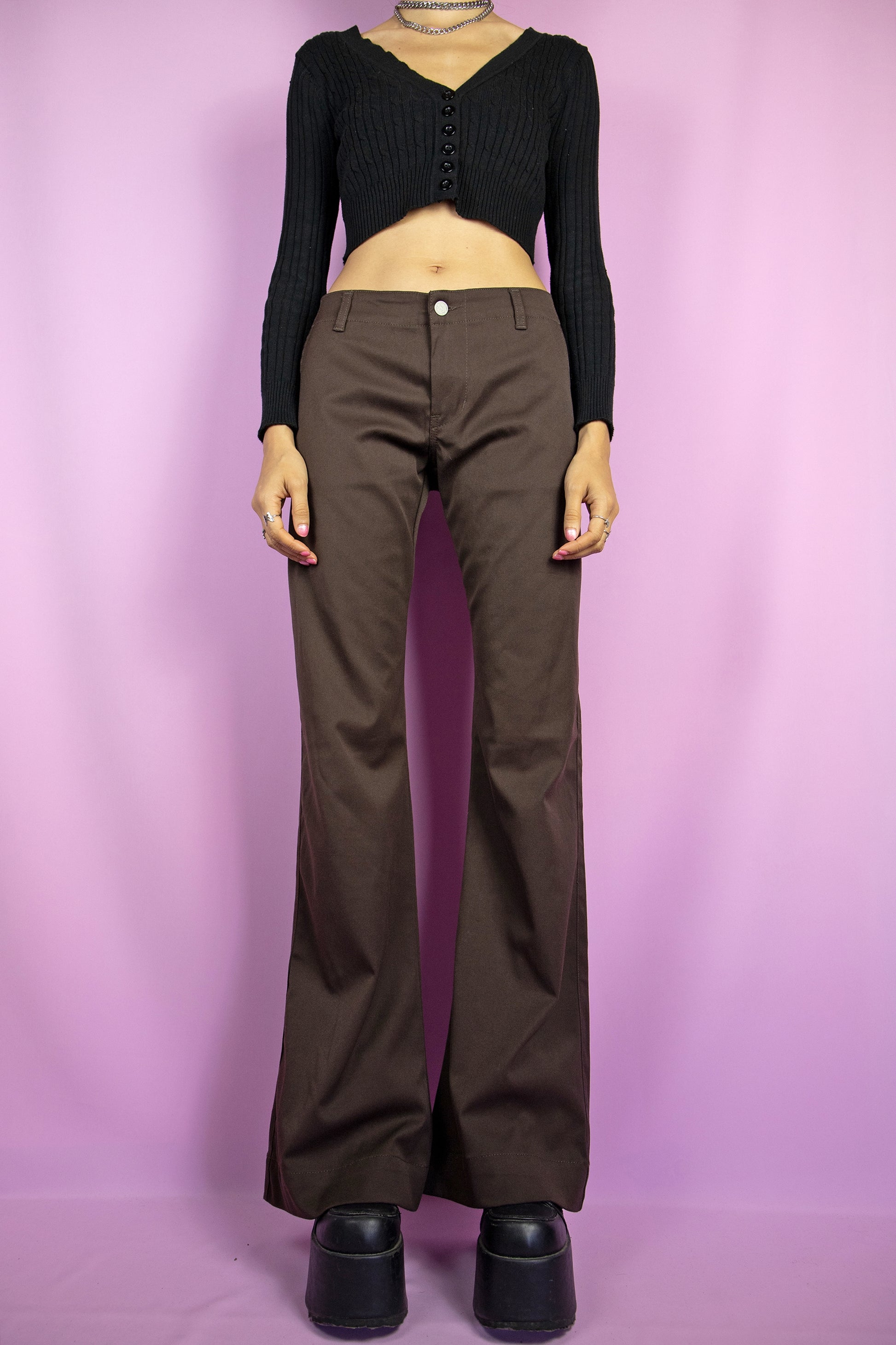 The Y2K Brown Flare Jeans are vintage 2000s mid-rise stretchy wide pants with pockets. Made in Italy.