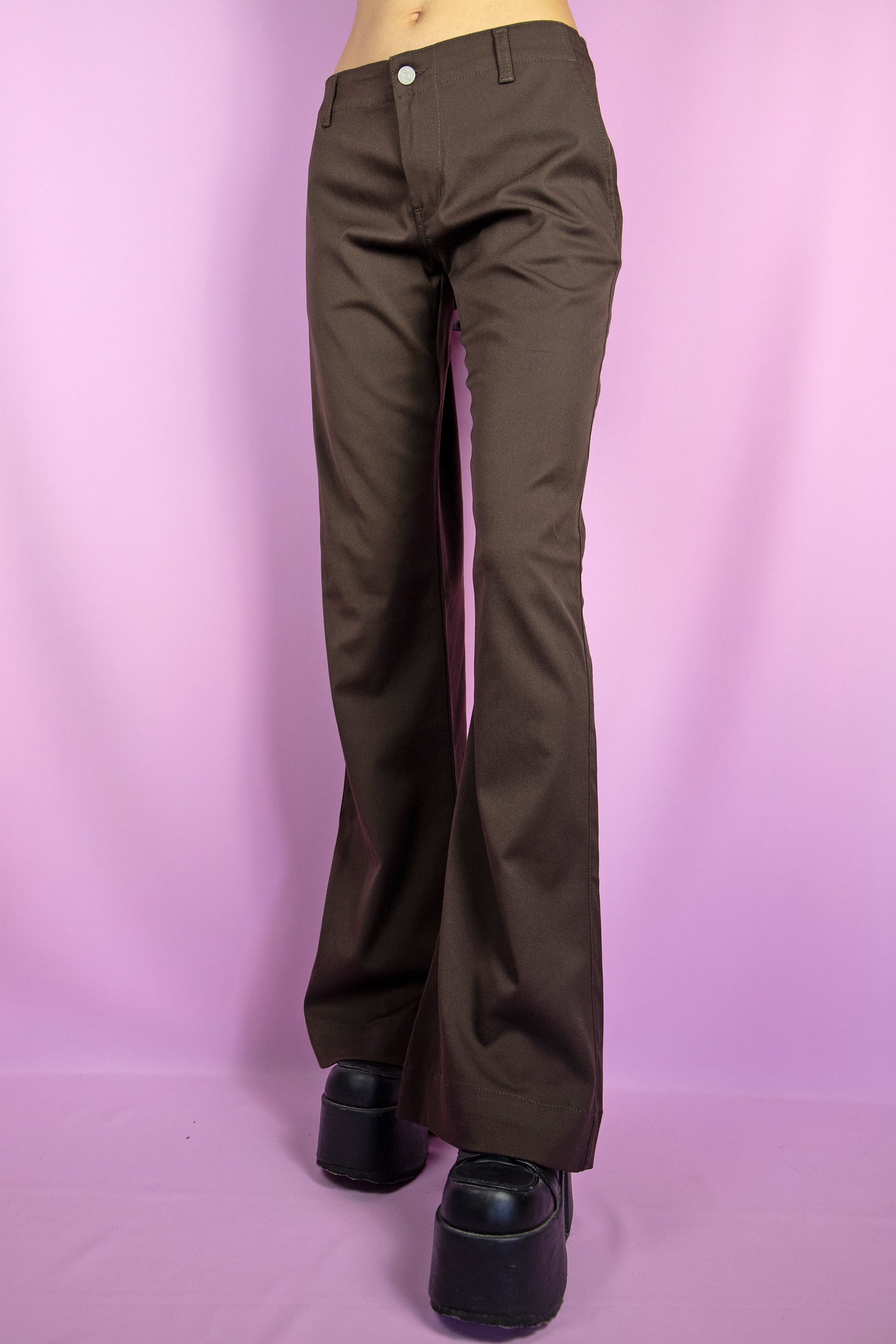 The Y2K Brown Flare Jeans are vintage 2000s mid-rise stretchy wide pants with pockets. Made in Italy.