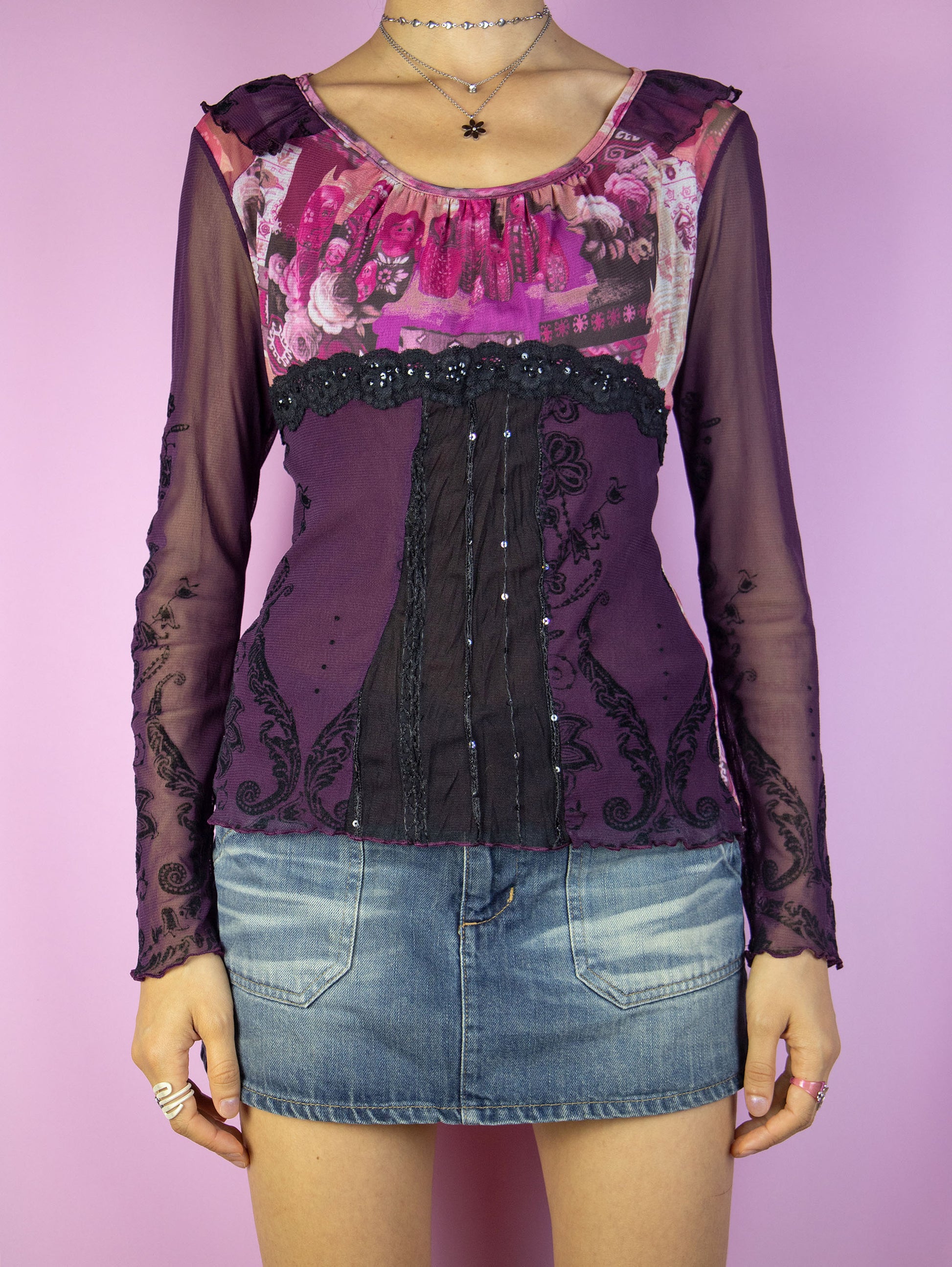 The Y2K Purple Graphic Mesh Top is a vintage 2000s romantic fairy grunge inspired burgundy, pink and multicolored abstract floral print semi-sheer long-sleeve top with ruffles, black lace detailing, and lettuce hem. Made in France.