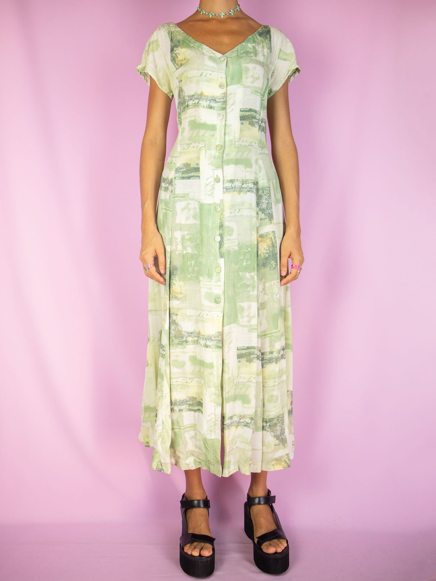 The Vintage 90s Abstract Print Midi Dress is a boho summer style green and white graphic short sleeve button flare maxi dress.