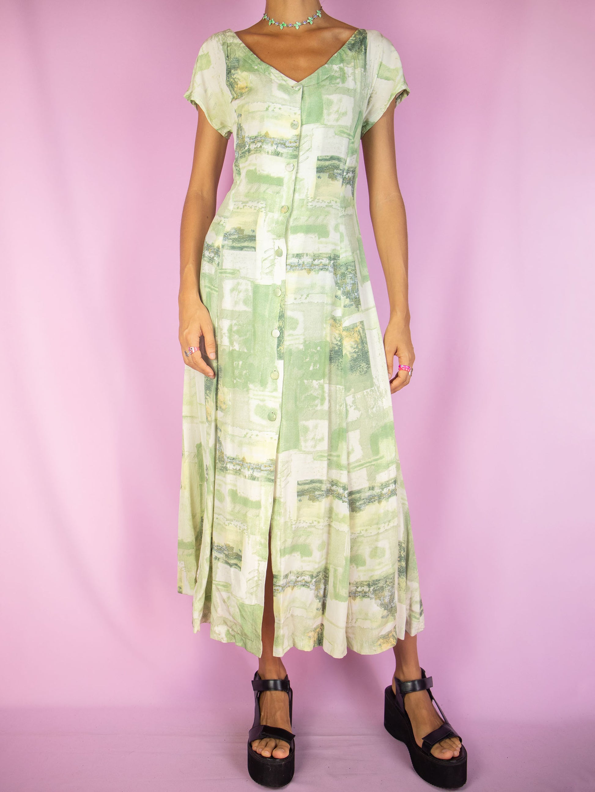 The Vintage 90s Abstract Print Midi Dress is a boho summer style green and white graphic short sleeve button flare maxi dress.