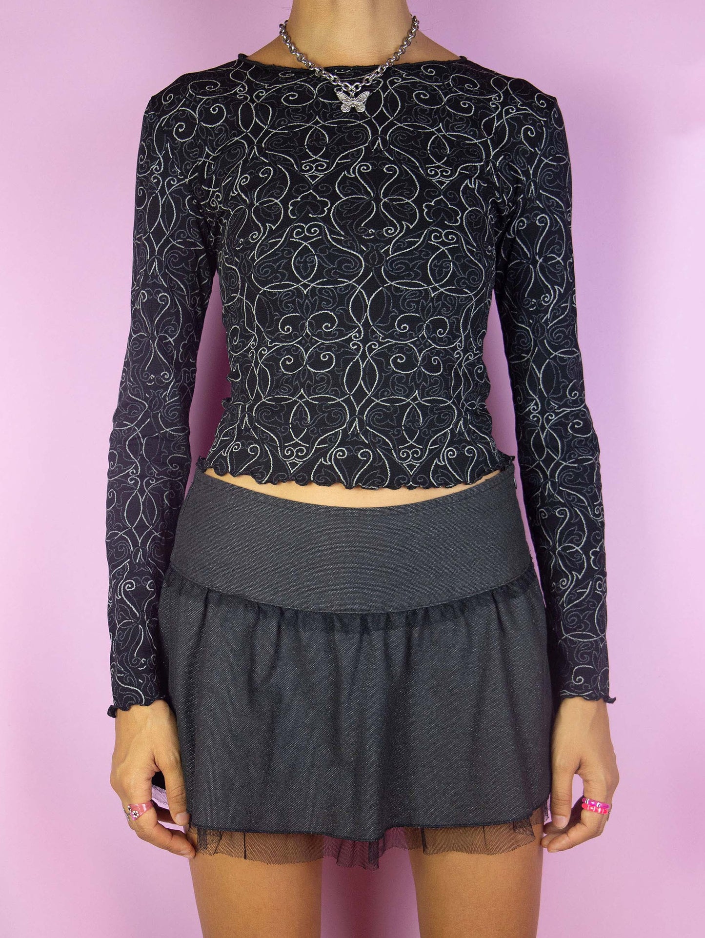 The Y2K Black Graphic Mesh Top is a vintage 2000s subversive grunge style black and gray abstract line printed long sleeve shirt with lettuce hem.
