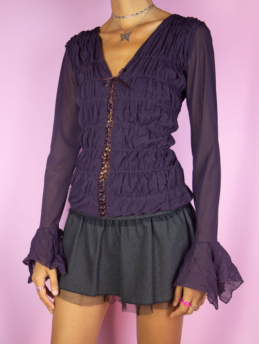 The Y2K Dark Purple Mesh Blouse is a vintage long bell sleeve ruched semi-sheer mesh dark purple top with lace-up front. Romantic fairy grunge whimsygoth 2000s shirt.