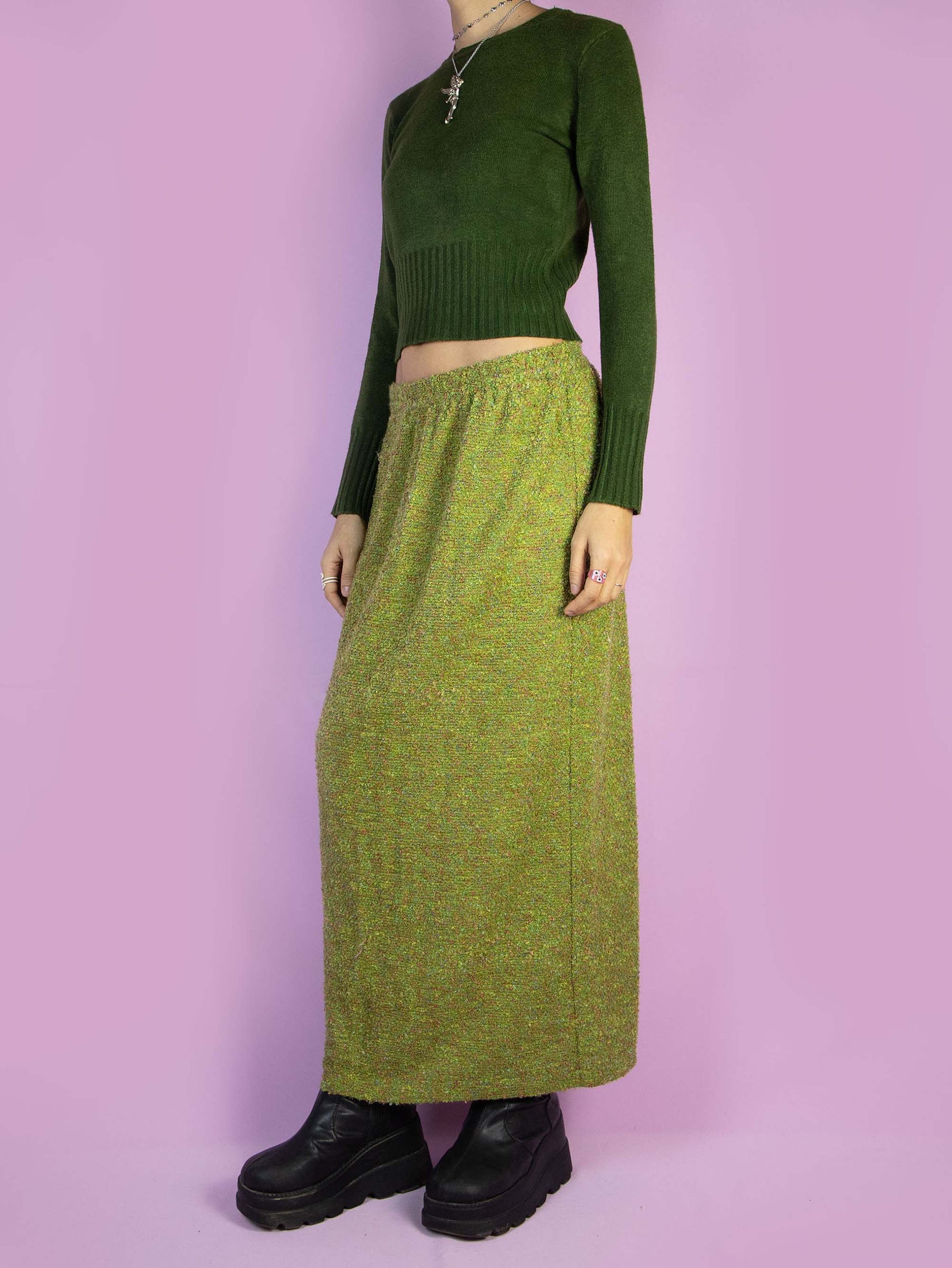 The Vintage 90s Green Knit Midi Skirt is a long winter skirt with an elastic waistband and a back slit. Boho 1990s knitted maxi skirt.