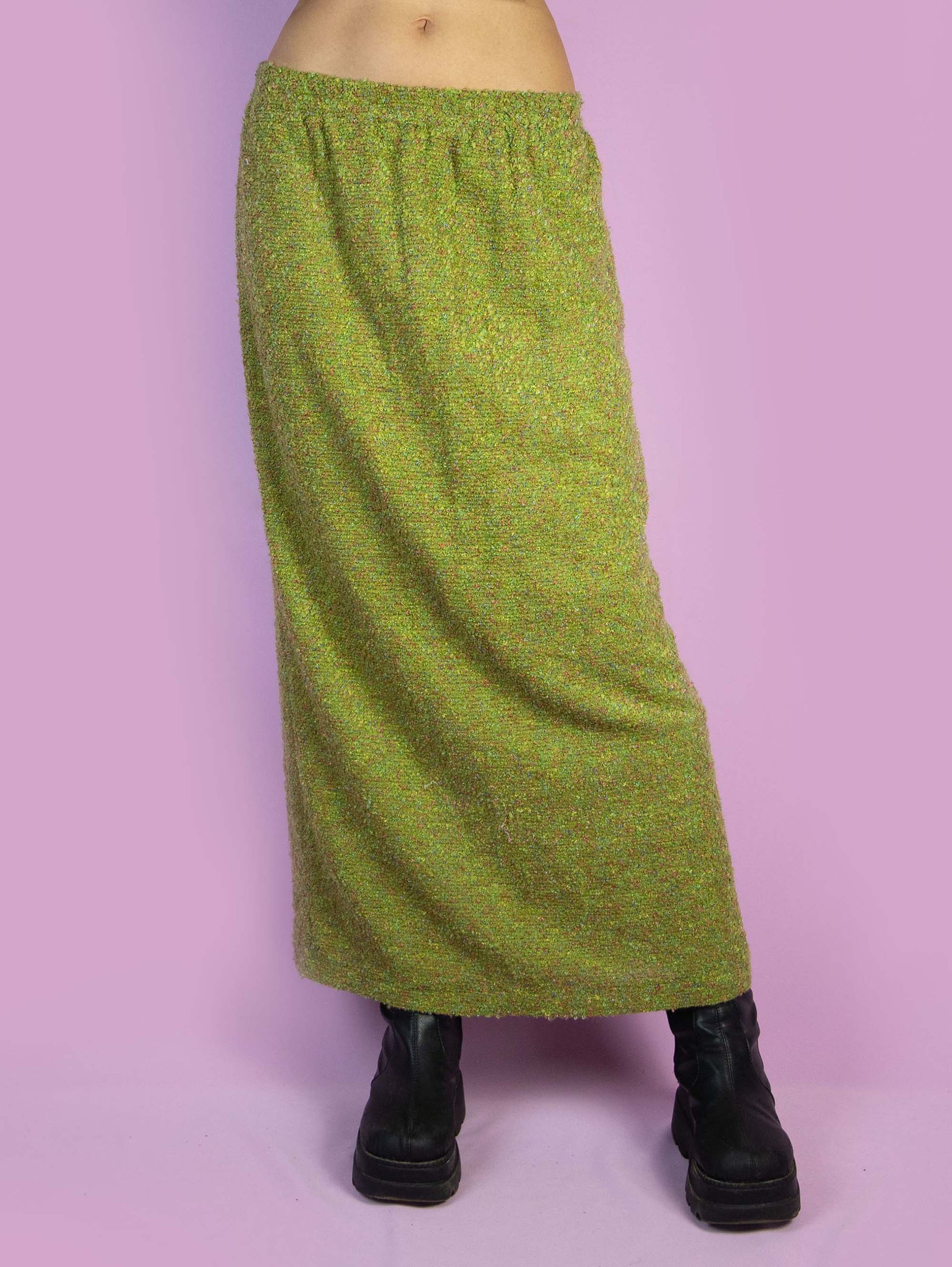 The Vintage 90s Green Knit Midi Skirt is a long winter skirt with an elastic waistband and a back slit. Boho 1990s knitted maxi skirt.