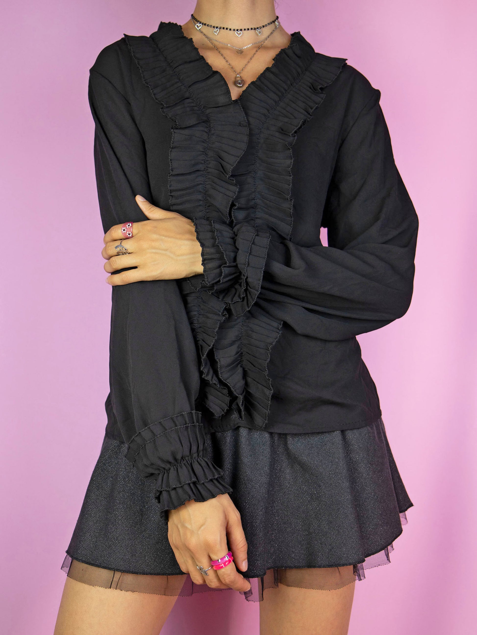 The Y2K Black Ruffle Blouse is a vintage semi-sheer black balloon sleeve top with ruffles. Dark romantic whimsygoth 2000s shirt.