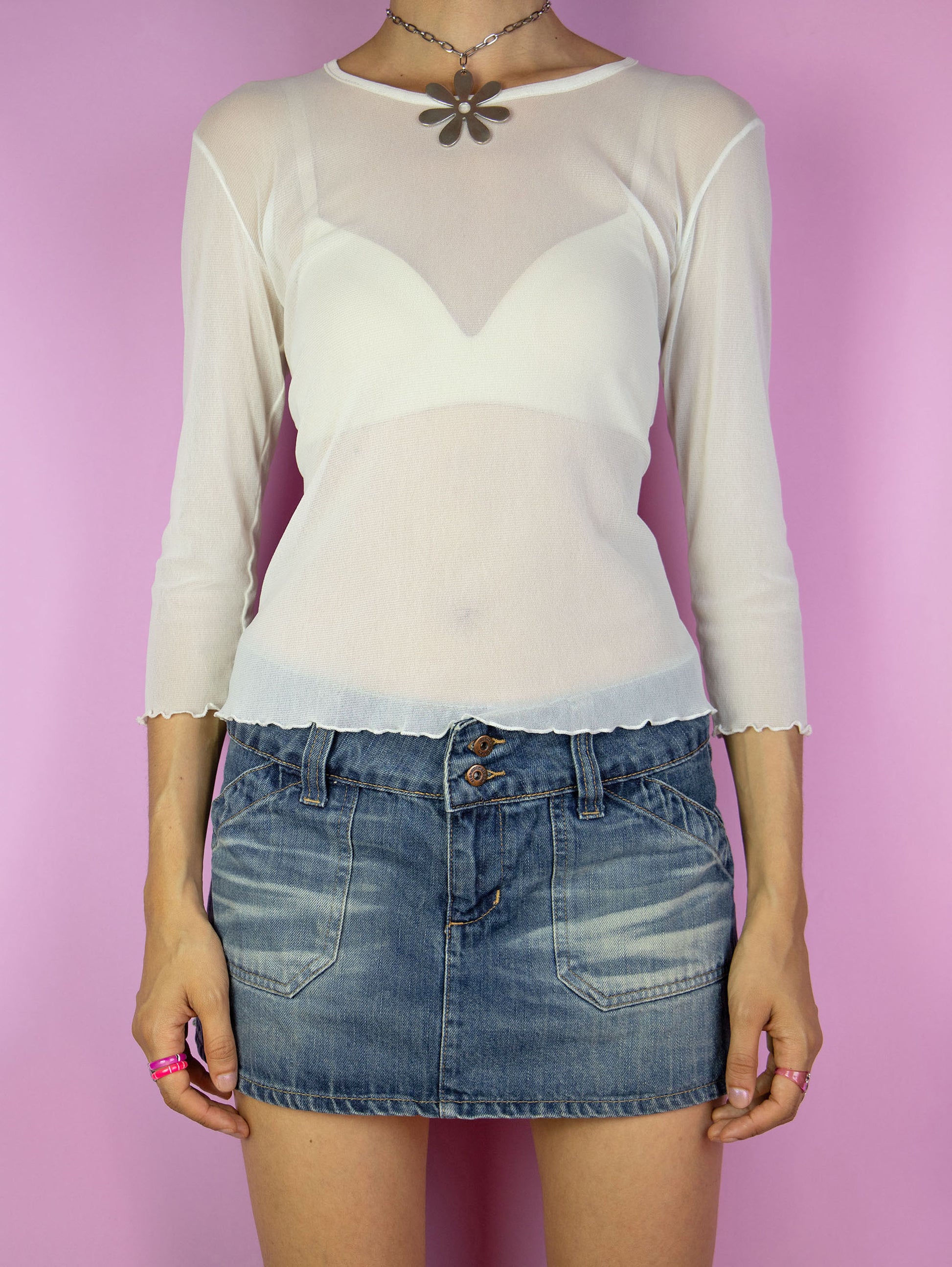 The Vintage 90s Mesh Sheer White Top is a cream off white three-quarter sleeve semi-sheer mesh shirt. Romantic fairy grunge 1990s transparent top.