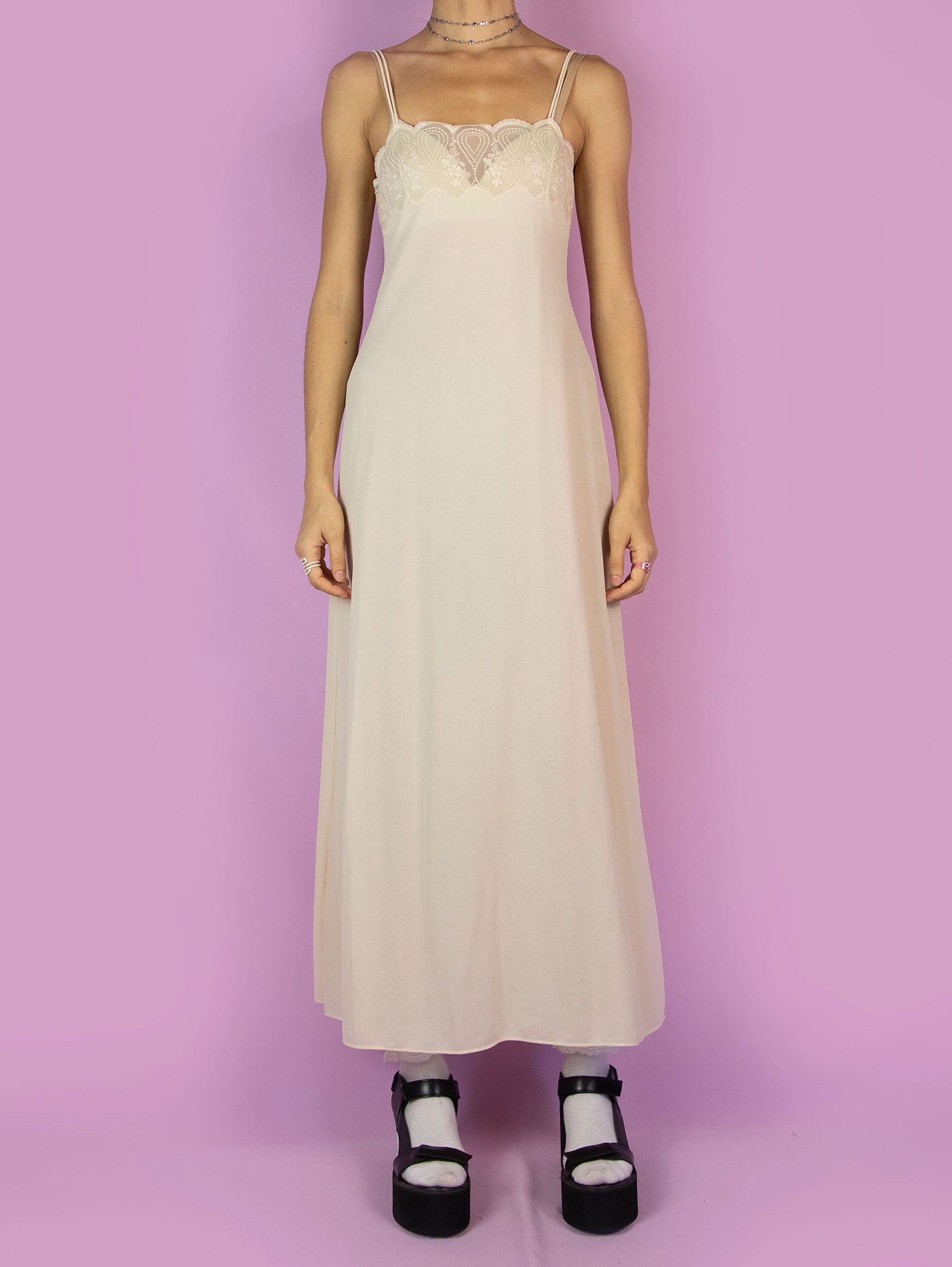 The Vintage 90s Beige Slip Maxi Dress is a romantic light beige-cream semi-sheer midi cami night dress with double straps and lace detail at the front.
