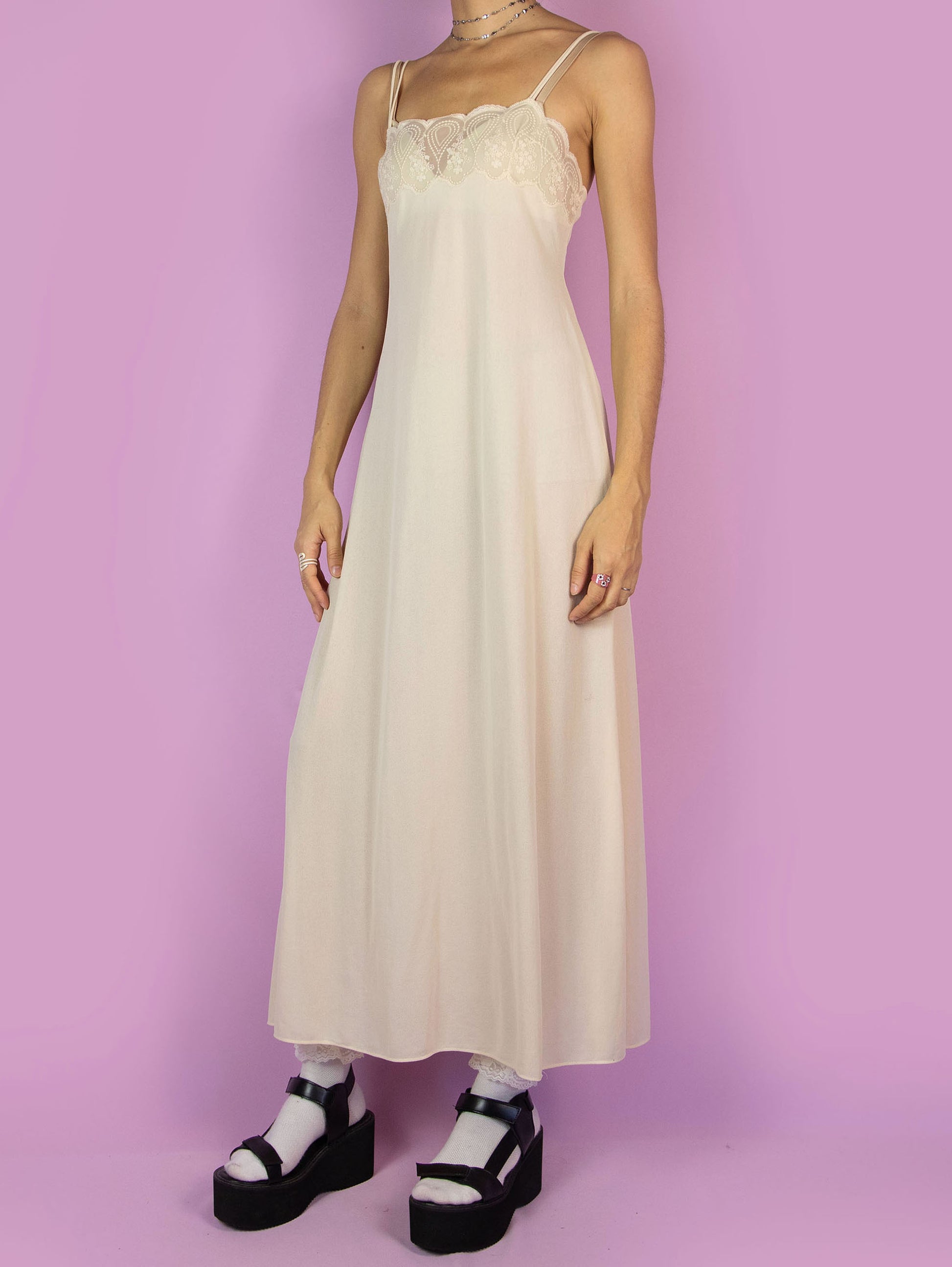 The Vintage 90s Beige Slip Maxi Dress is a romantic light beige-cream semi-sheer midi cami night dress with double straps and lace detail at the front.