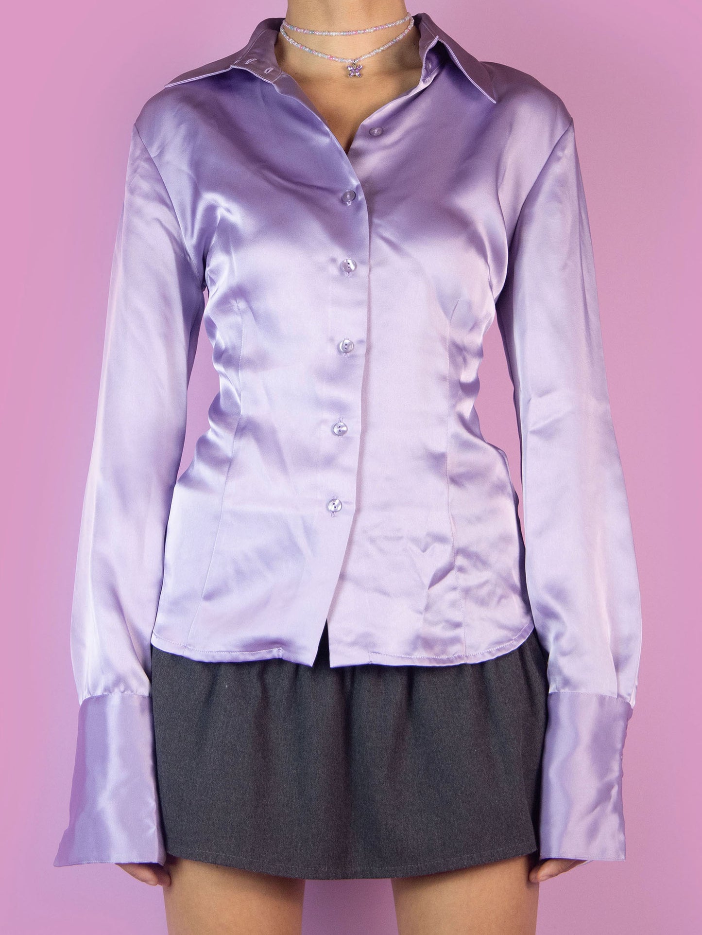 The Y2K Purple Satin Blouse is a fitted shirt with a collar and buttons. Elegant preppy 2000s office work blouse.