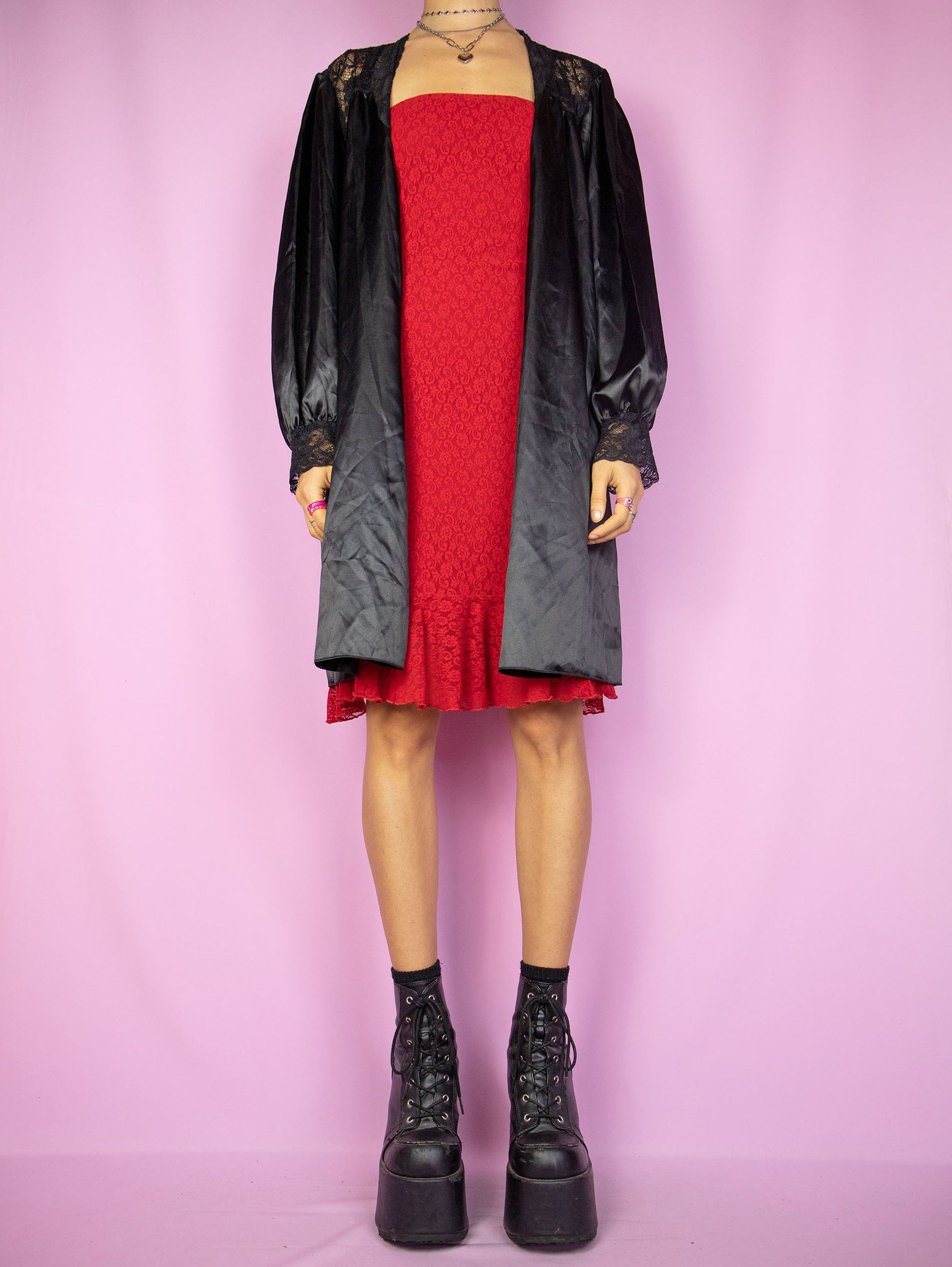 The Vintage 90s Black Satin Duster Jacket is a shiny balloon sleeve tie-front robe peignoir lounge sleepwear with lace details. Made in Spain.