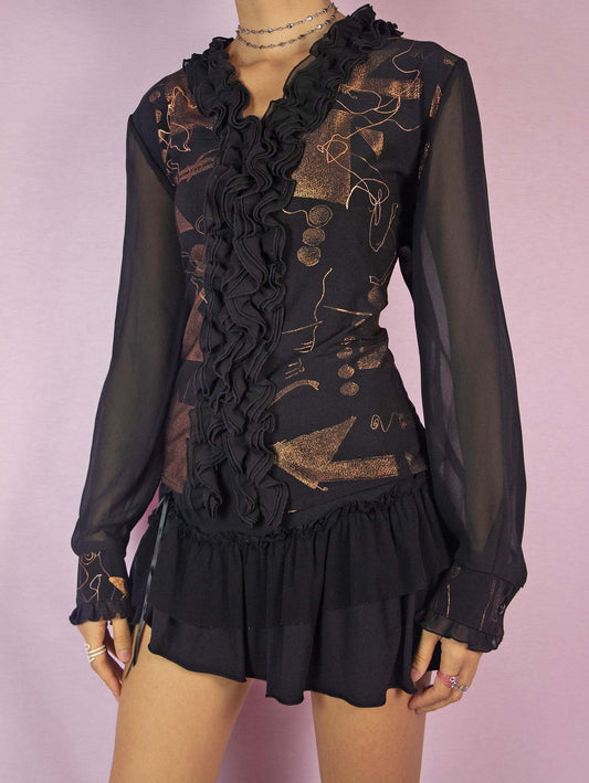 The Vintage 90s Black Ruffle Frill Top is an avant-garde, extravagant, glam style party blouse featuring a shiny metallic bronze and copper abstract painted pattern, buttons, and a V-neckline.
