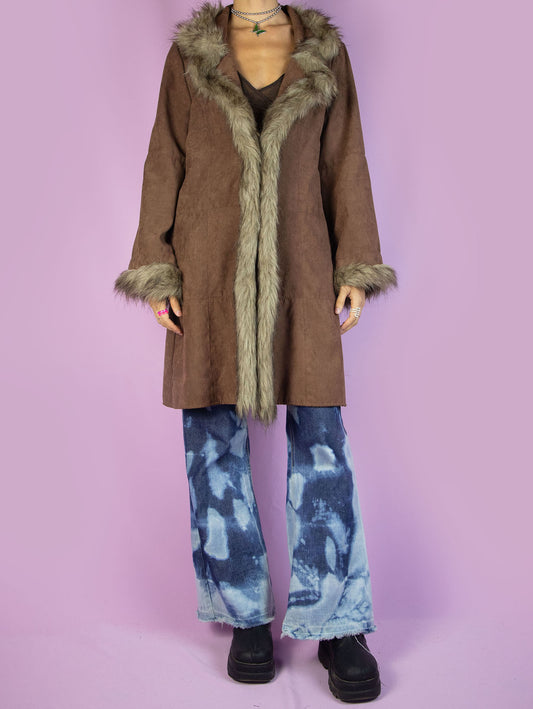 The Y2K Brown Penny Lane Coat is a vintage 2000s faux suede jacket featuring a faux fur collar and cuffs, pockets, and a tied front. Perfect for any autumn or elegant evening outfit.