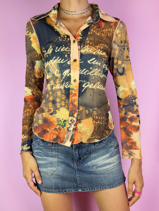 The Y2K Printed Mesh Blouse is a vintage 2000s top featuring a semi-sheer fabric with an abstract graphic reminiscent of a renaissance painting style. It includes a collar and button-down front, adding a unique artistic flair to any outfit.