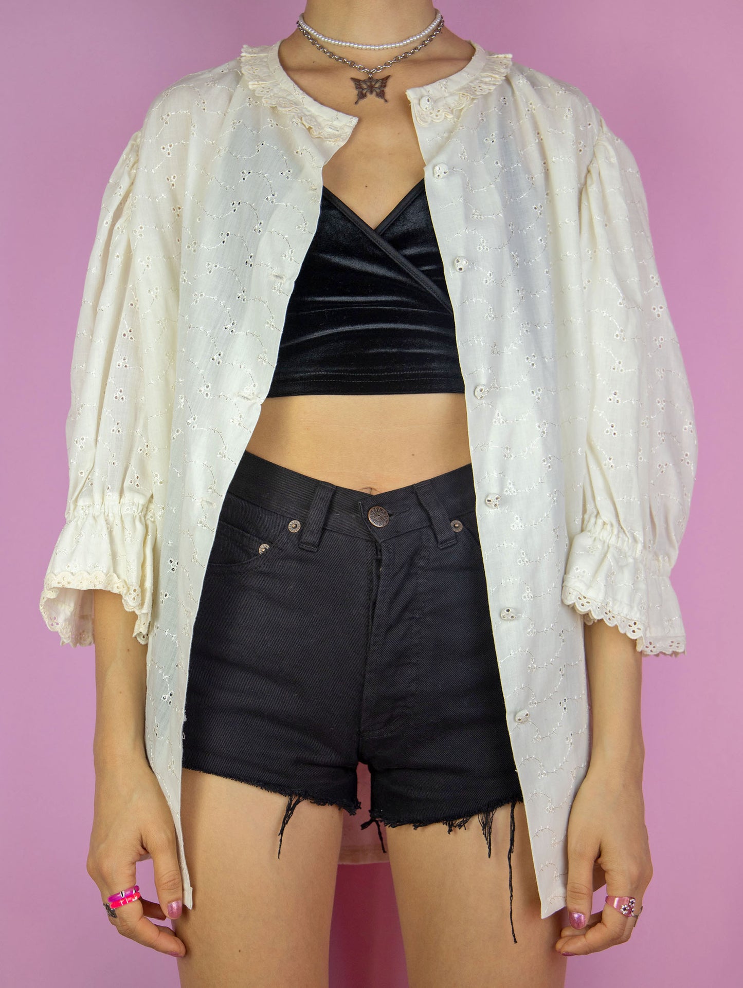 The Vintage 90s Cream White Blouse is a country cottage prairie inspired summer shirt with a ruffled neckline, lace trim and floral embroidery, buttons and puff sleeves.