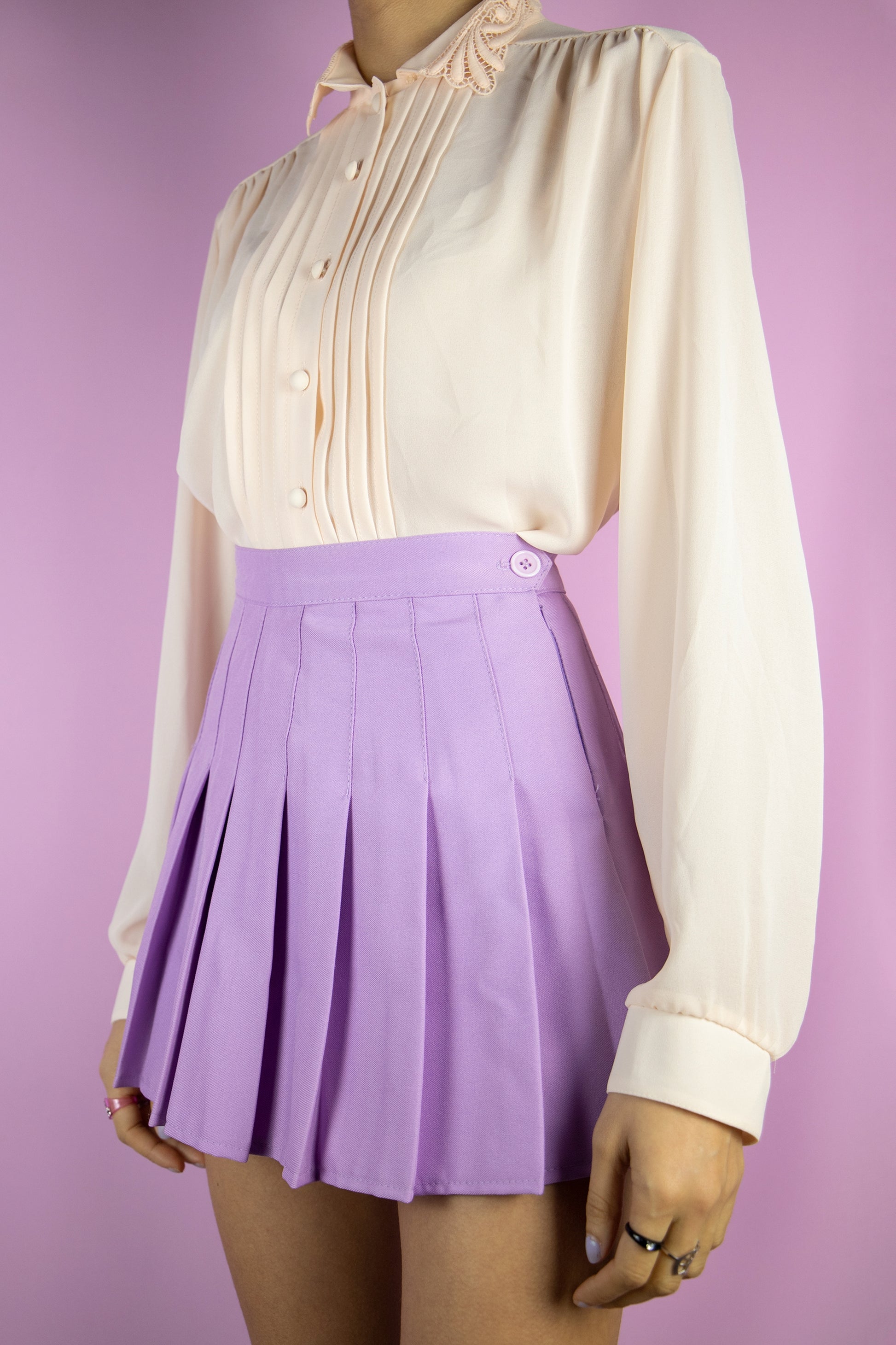 The Vintage 80s Light Pink Romantic Blouse is a semi sheer light pastel pink shirt with pleated front, collar and buttons. Preppy retro 1980s blouse.