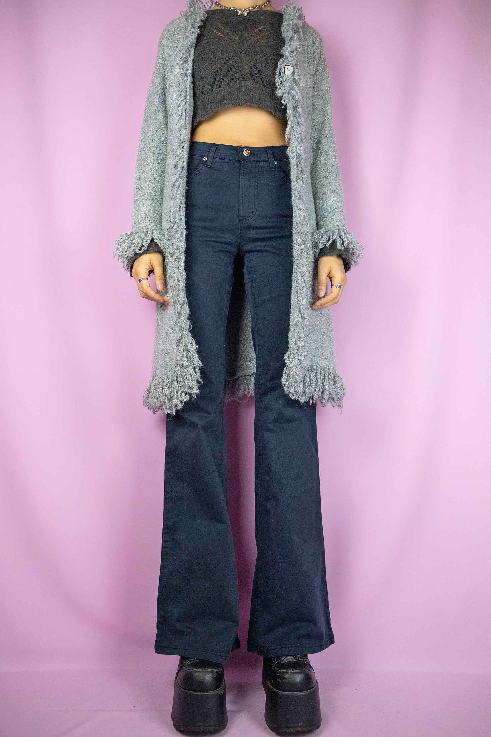 The Y2K Gray Penny Lane Cardigan is a vintage long shaggy knit cardigan with a one button closure and fringe trim at the neckline and cuffs. Cyber fairy grunge 2000s boho duster jacket.